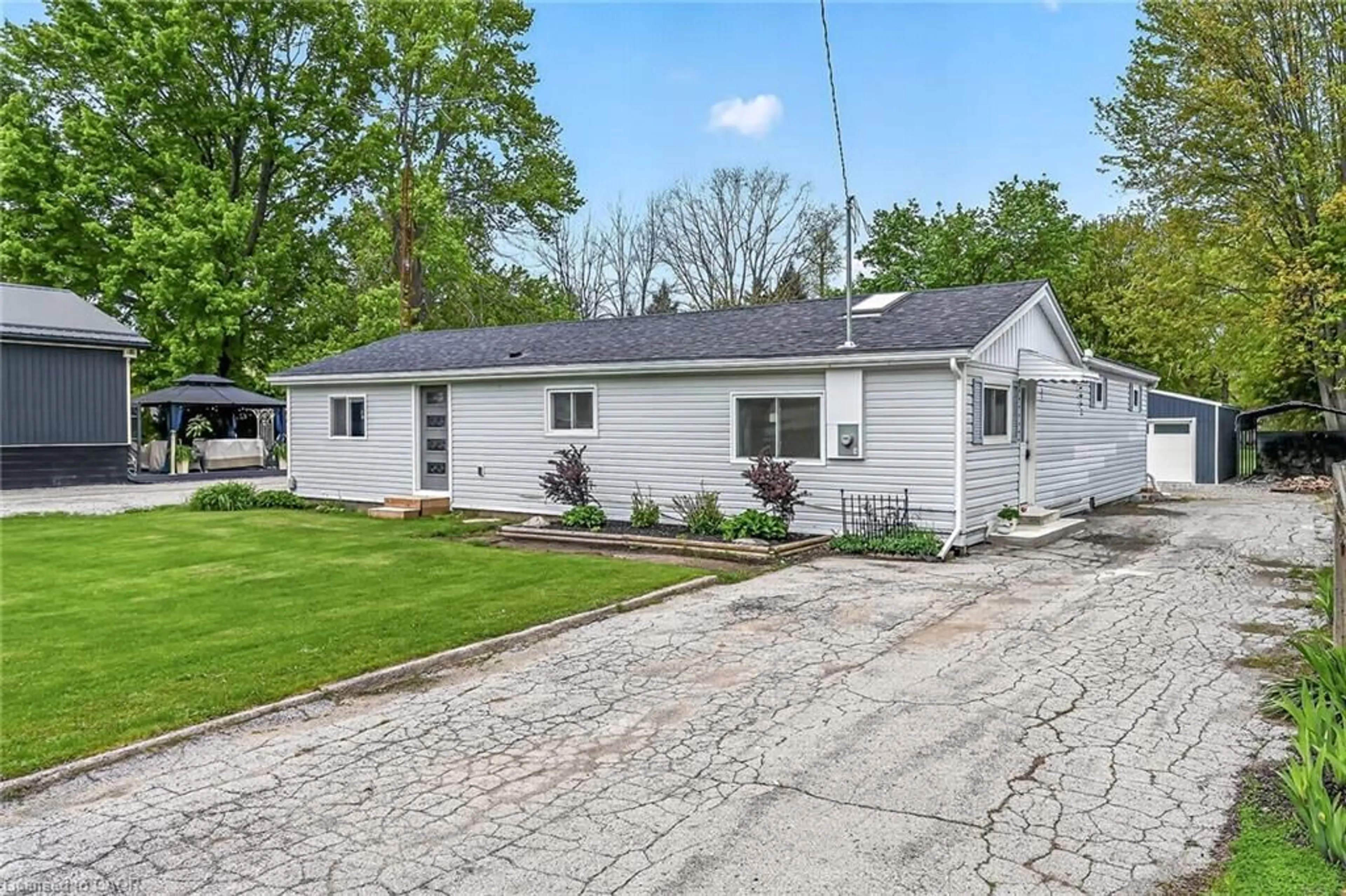 Home with vinyl exterior material, street for 13 Bill's Corners Rd, Simcoe Ontario N3Y 4K5
