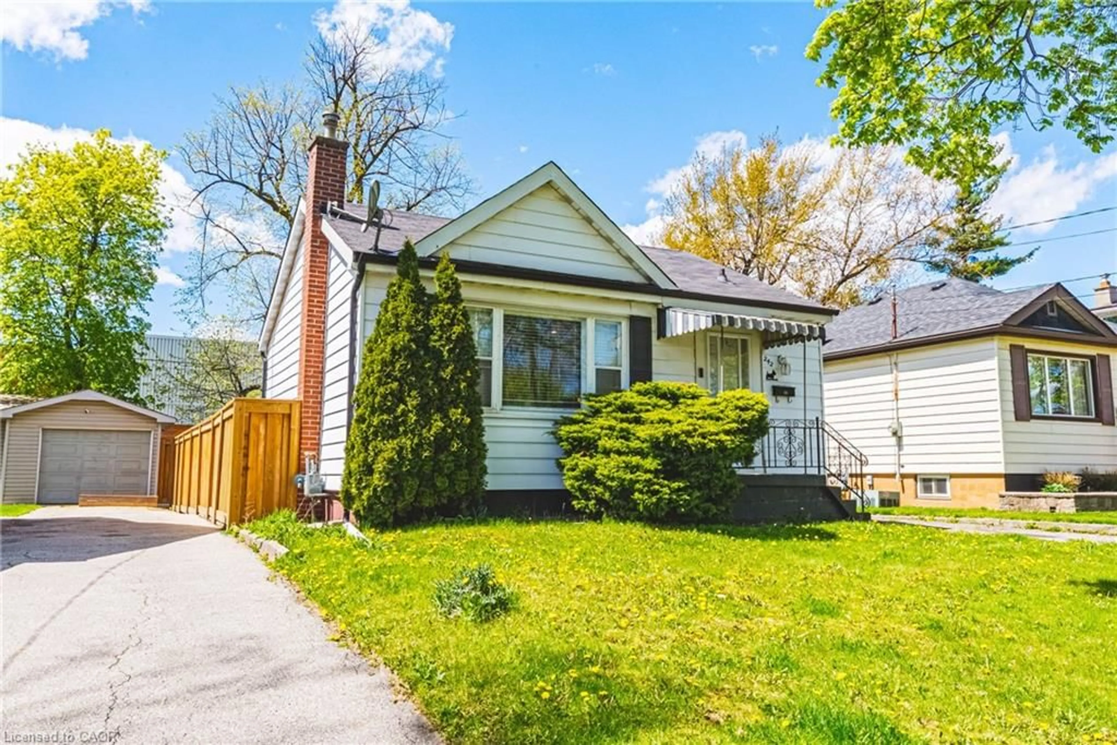 Home with vinyl exterior material, street for 242 East 43rd St, Hamilton Ontario L8T 3C5
