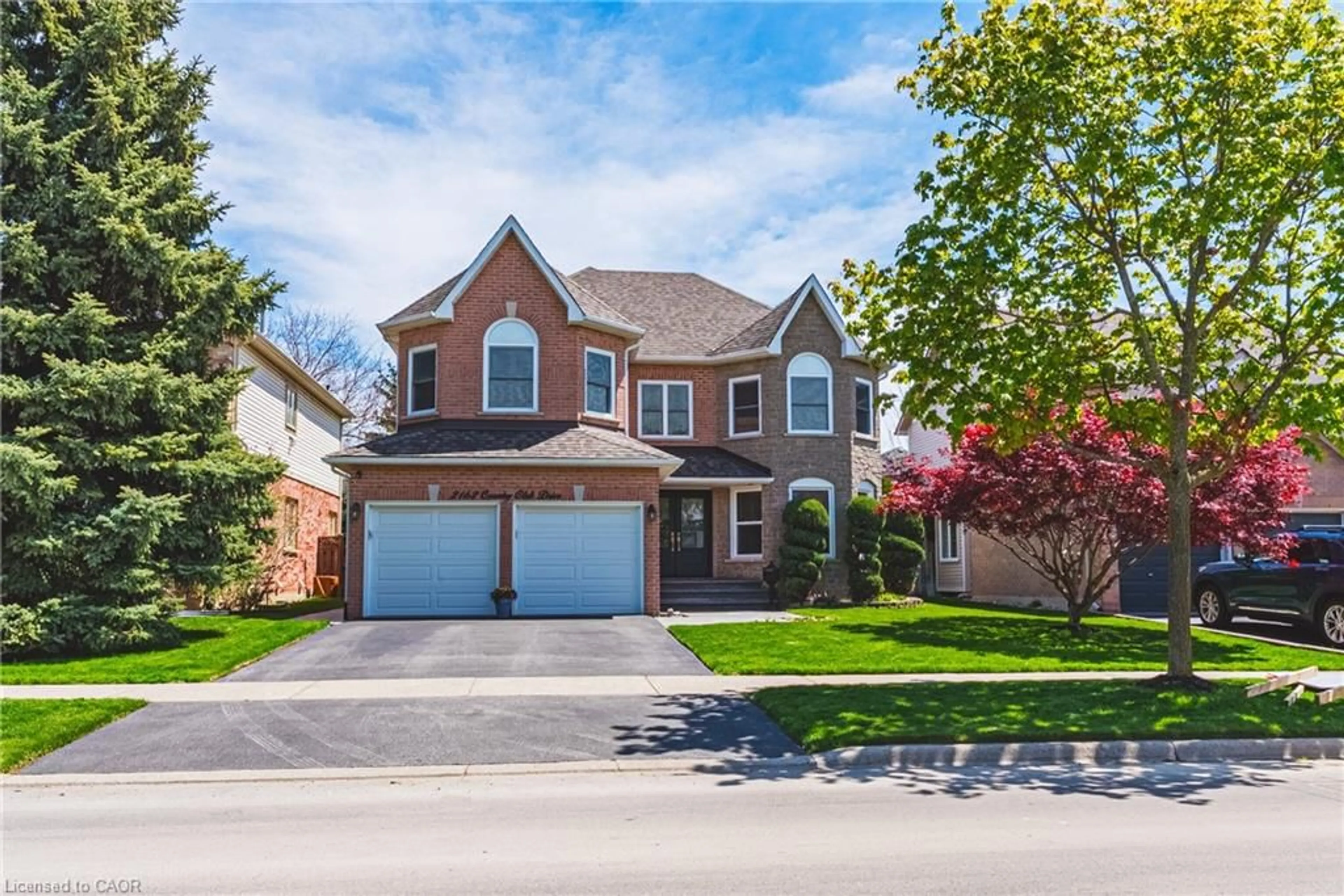 Home with brick exterior material, street for 2162 Country Club Dr, Burlington Ontario L7M 4B1