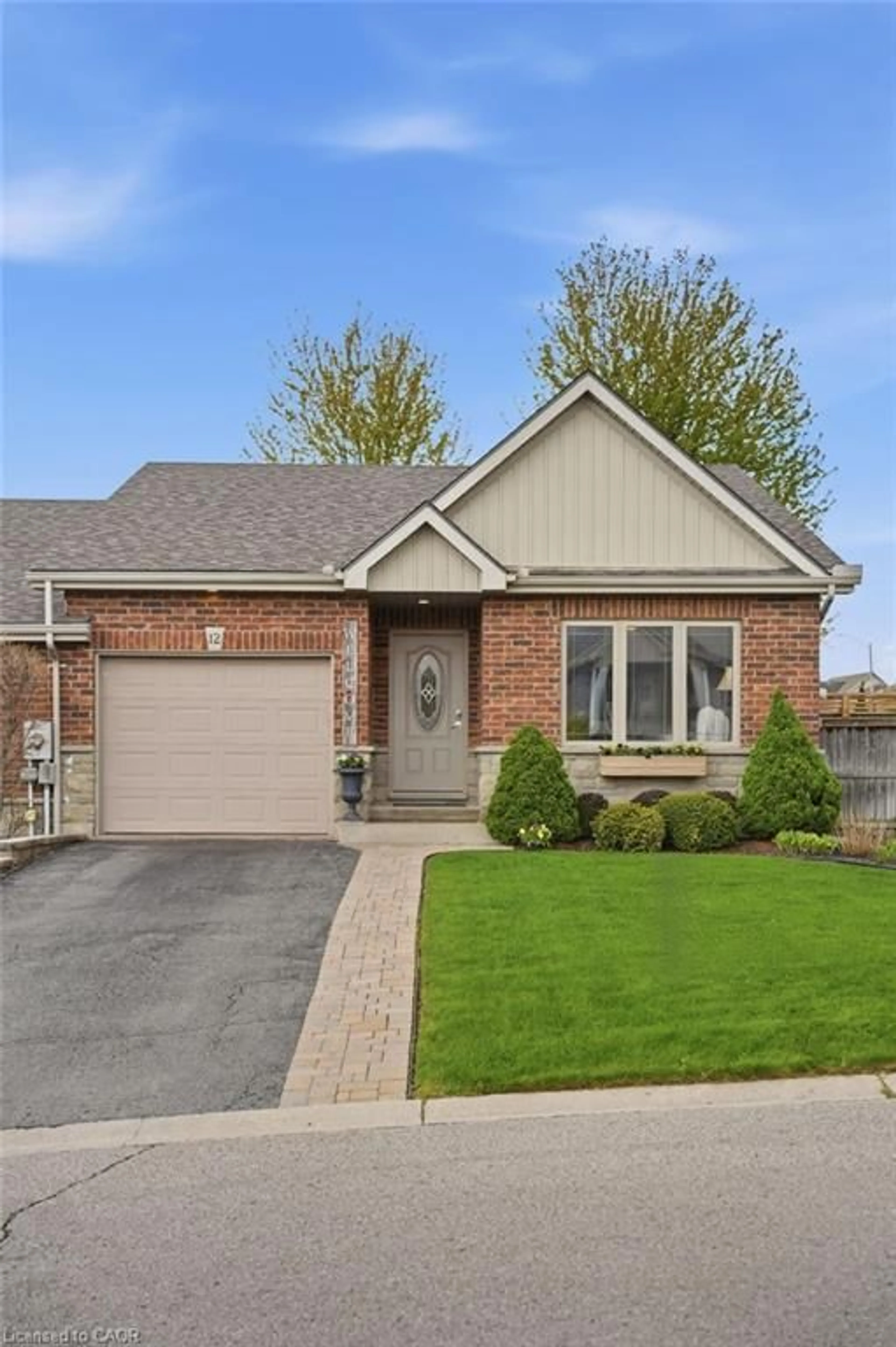 Home with brick exterior material, street for 12 Millcroft Dr, Simcoe Ontario N3Y 5M9