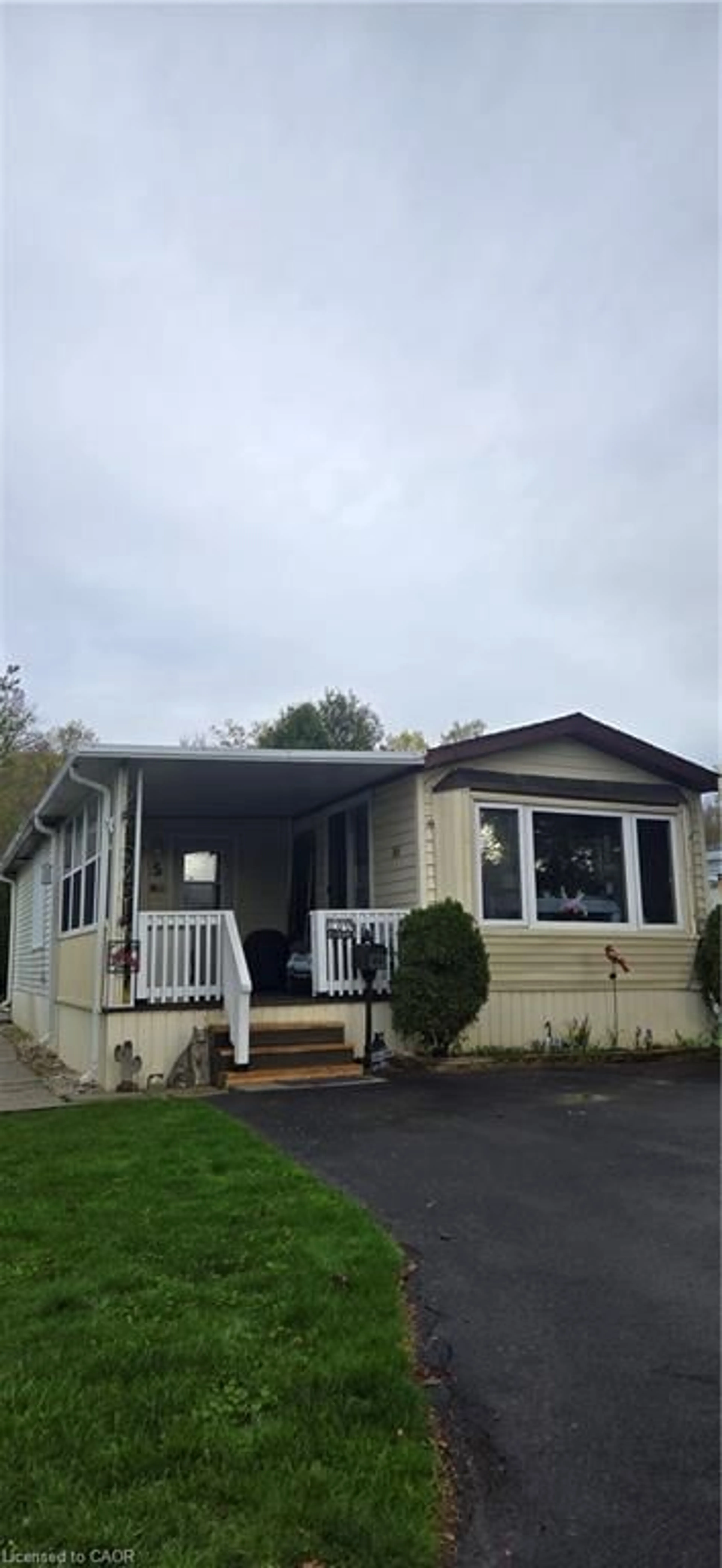 Home with vinyl exterior material, street for 2490 Governors Rd #5 Pondview, Ancaster Ontario