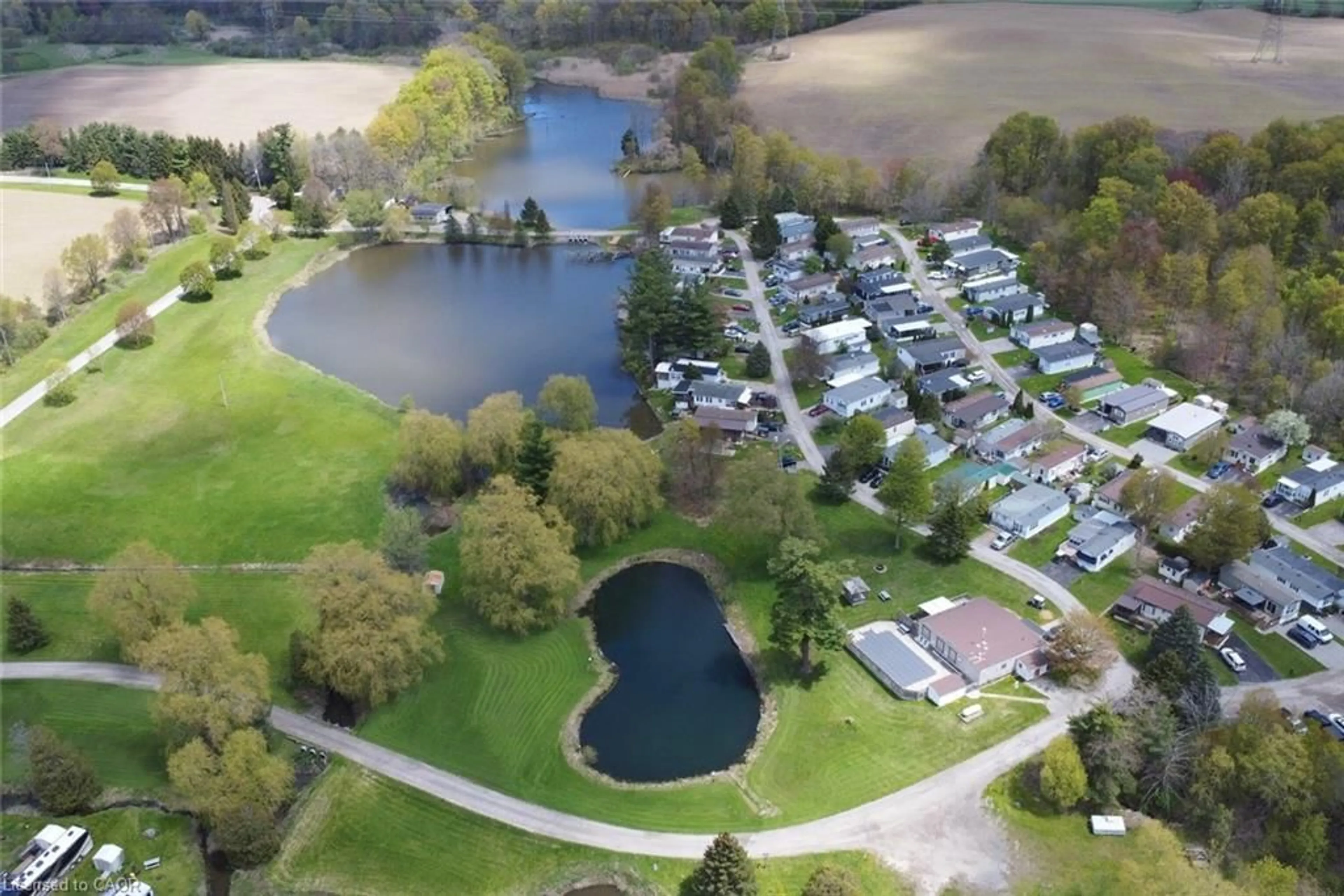 A pic from outside/outdoor area/front of a property/back of a property/a pic from drone, water/lake/river/ocean view for 2490 Governors Rd #5 Pondview, Ancaster Ontario