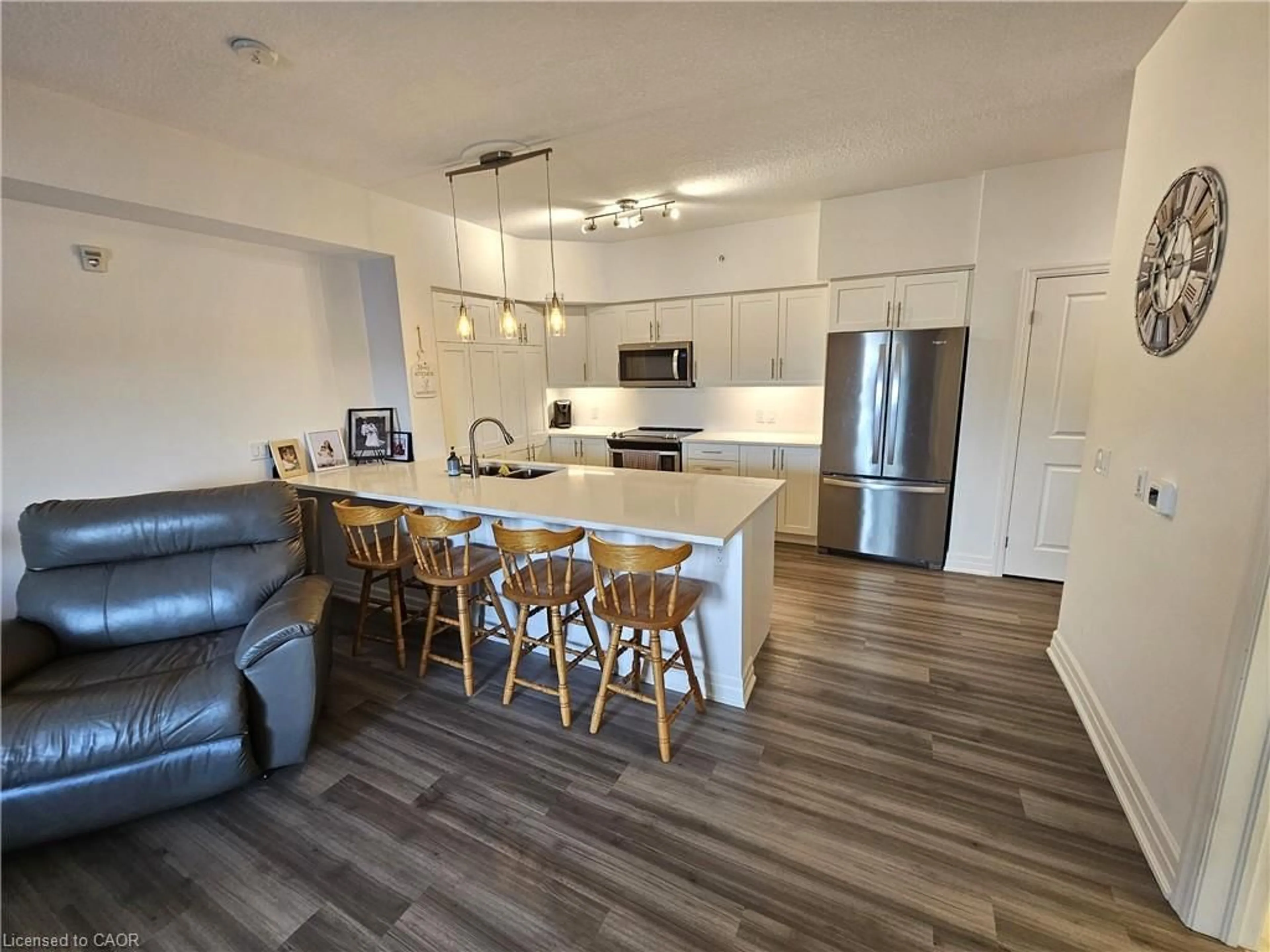 Open concept kitchen, wood/laminate floor for 39 Sister Varga Terr #117, Hamilton Ontario L9B 0J7