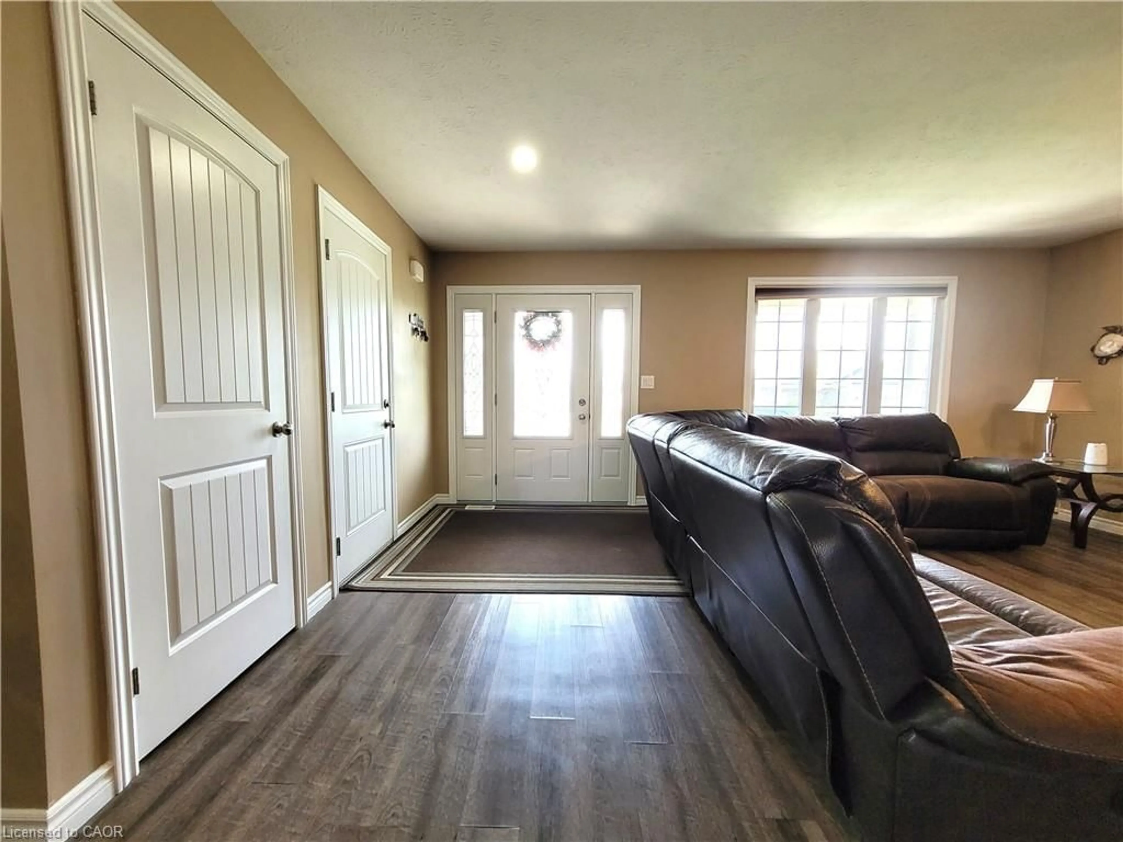 Living room with furniture, wood/laminate floor for 296 Donly Dr, Simcoe Ontario N3Y 0C8