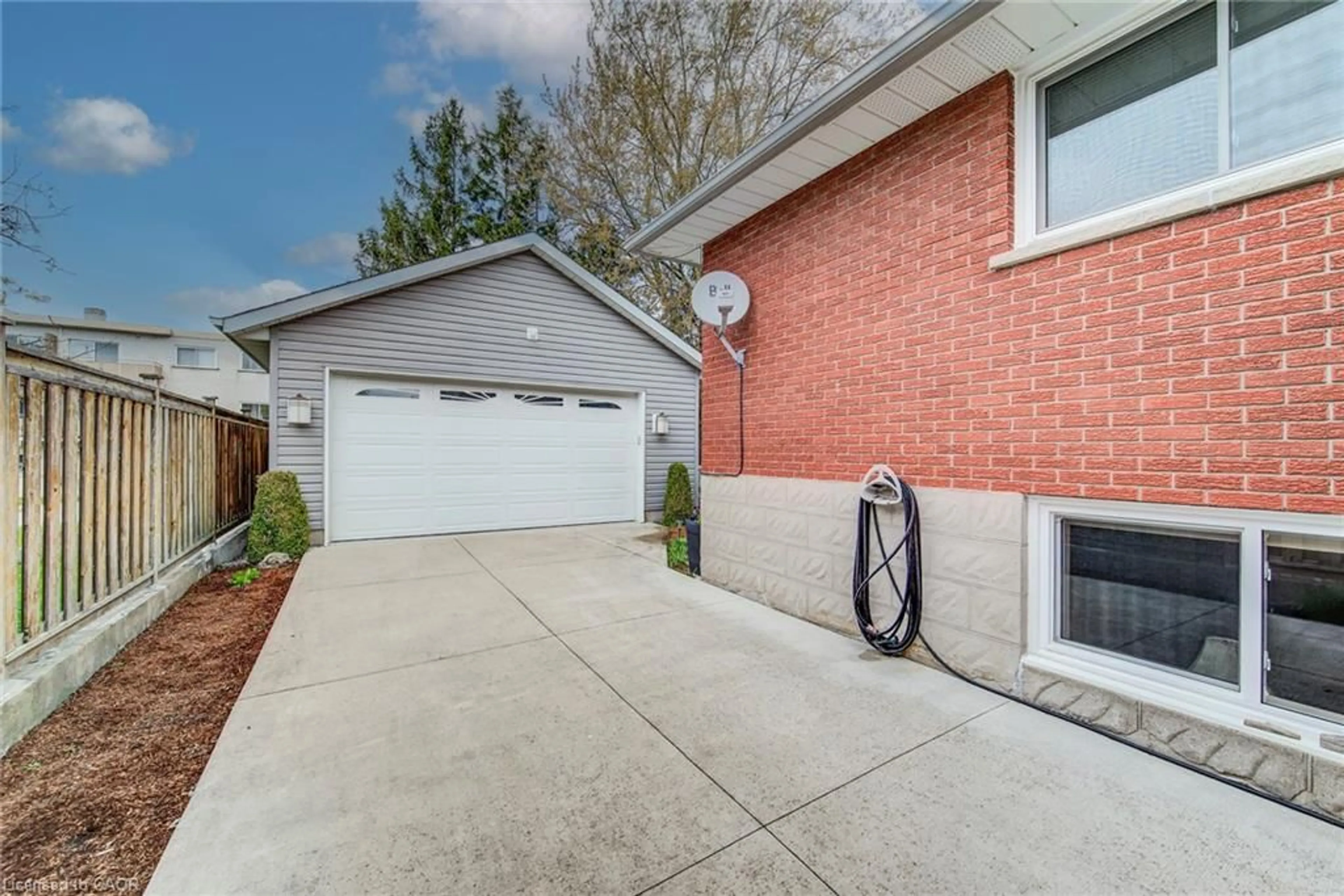 Home with brick exterior material, street for 18 Queenston Cres, Kitchener Ontario N2B 2V5