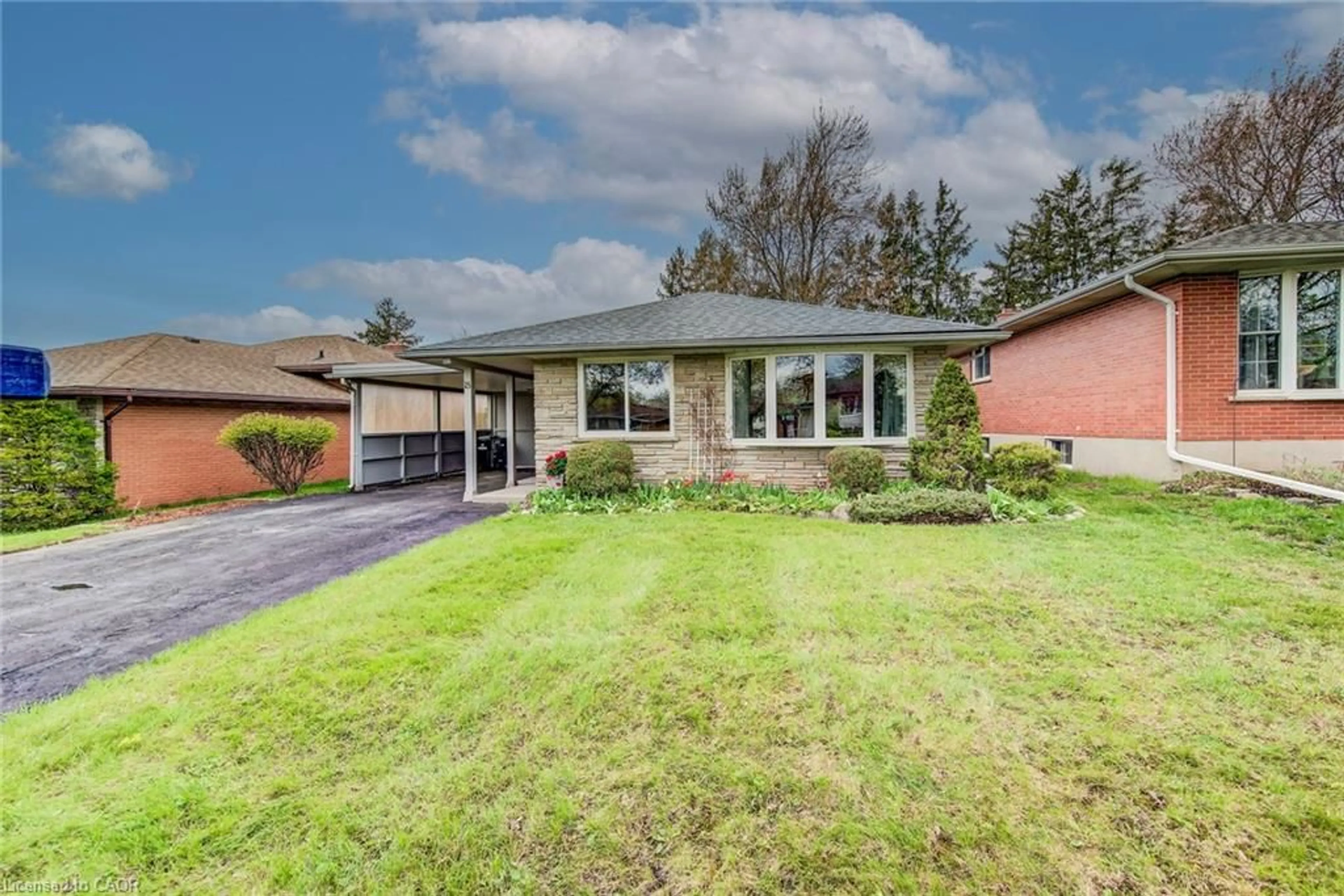 Home with brick exterior material, street for 18 Queenston Cres, Kitchener Ontario N2B 2V5