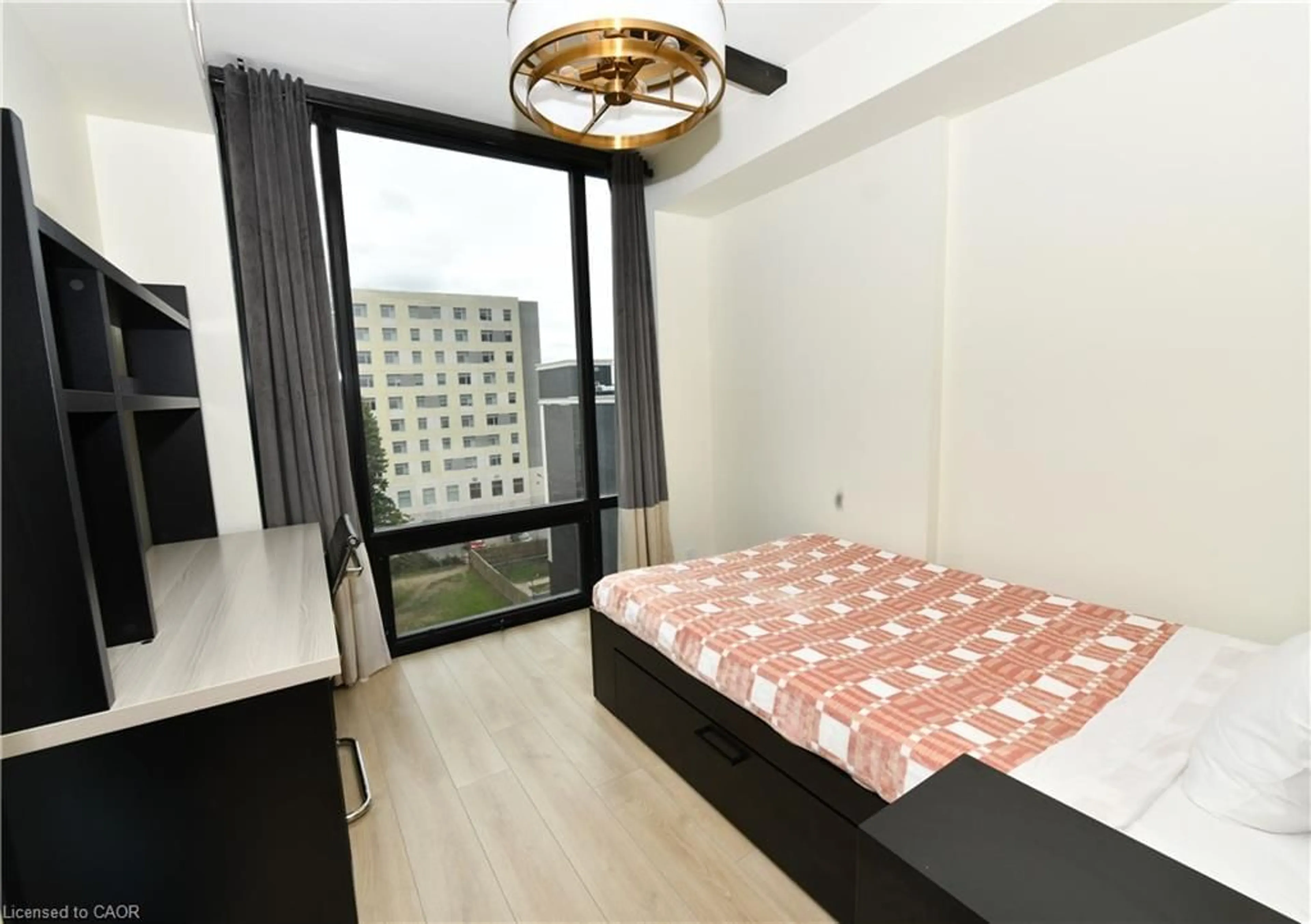 Bedroom with bed, wood/laminate floor for 145 Columbia St #736, Waterloo Ontario N2L 0K7