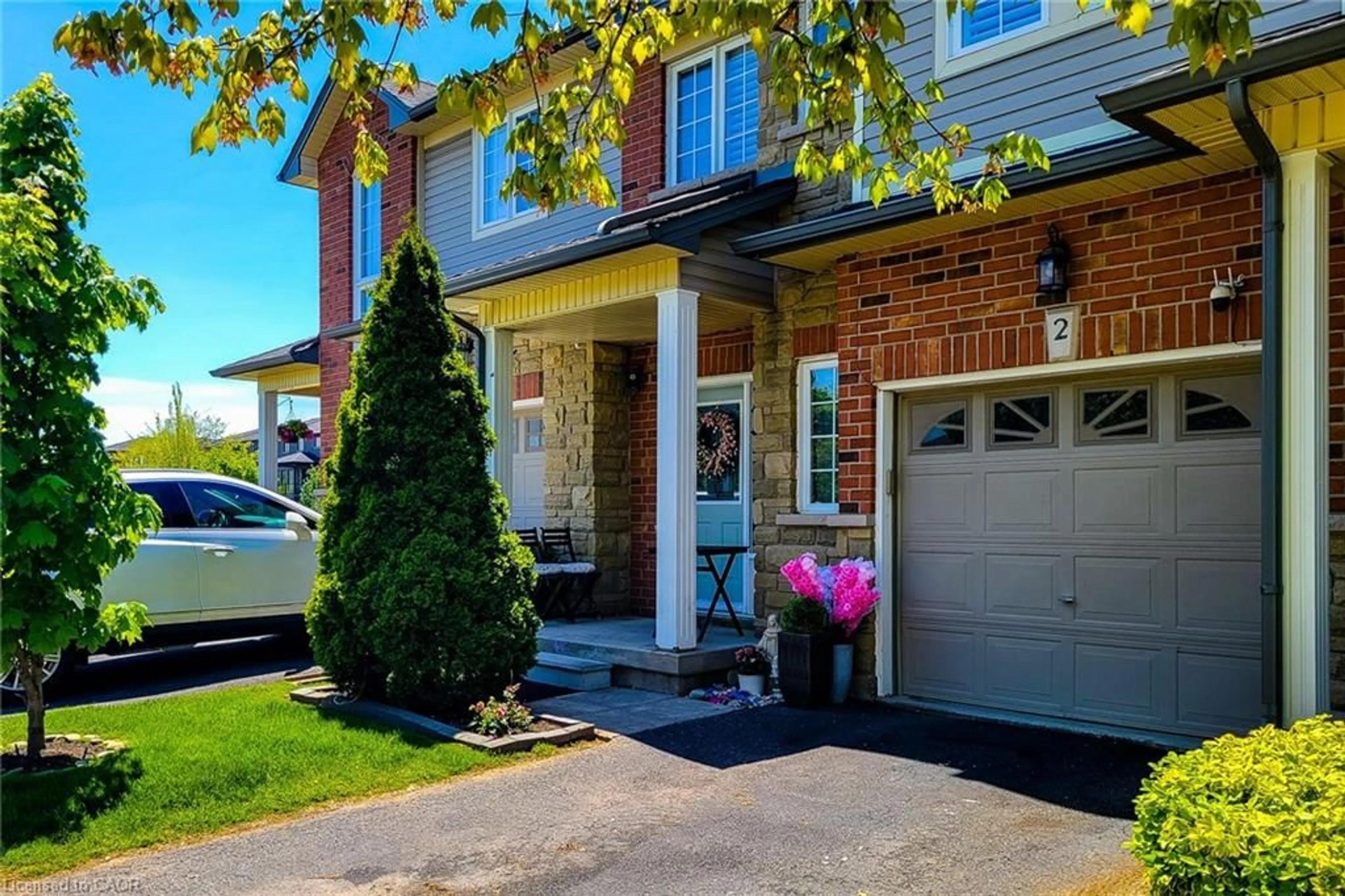 Home with brick exterior material, street for 232 Stonehenge Dr #2, Ancaster Ontario L9K 1R5