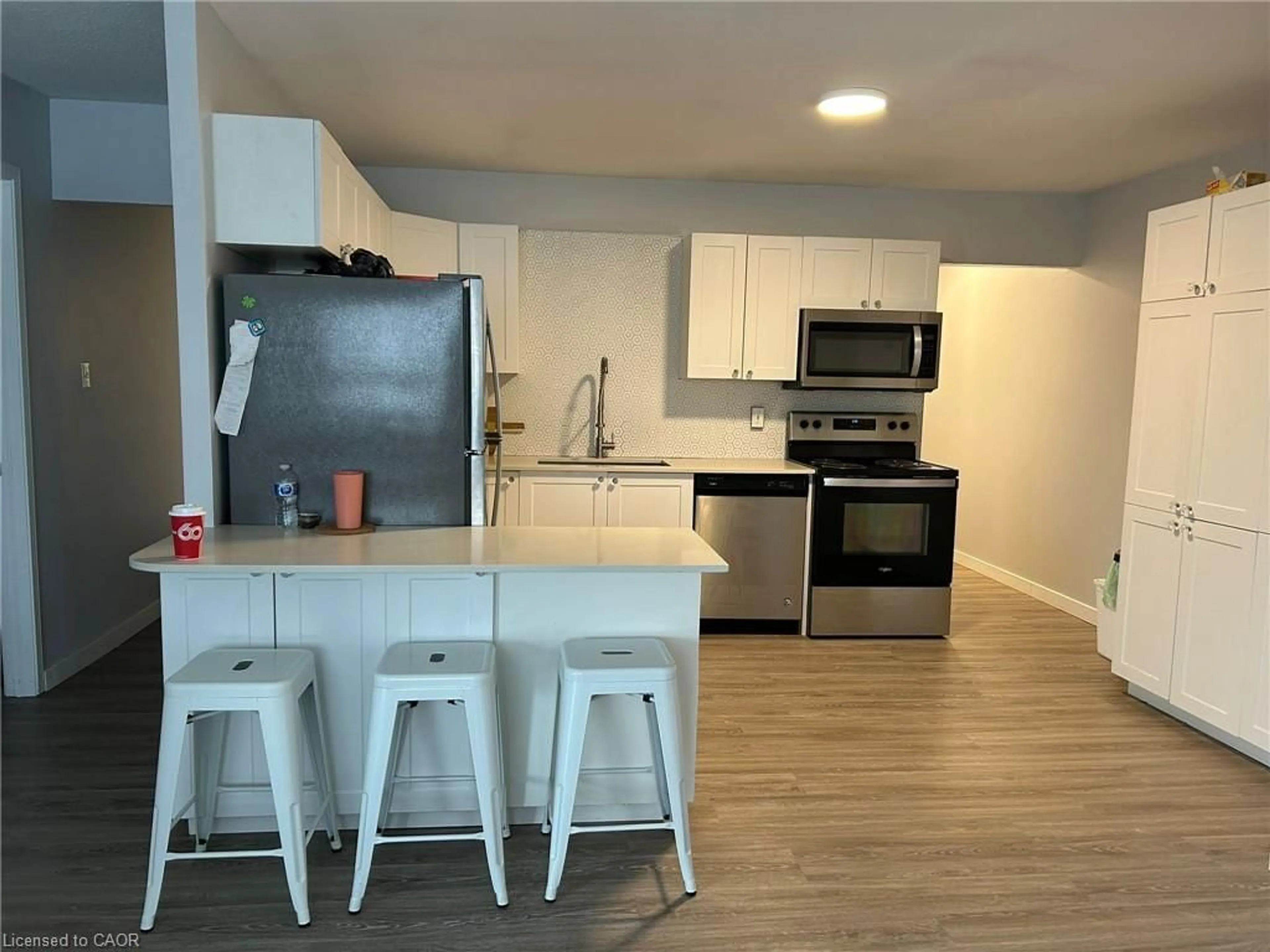 Open concept kitchen, wood/laminate floor for 91 Westmount Rd #3, Waterloo Ontario N2L 5G5