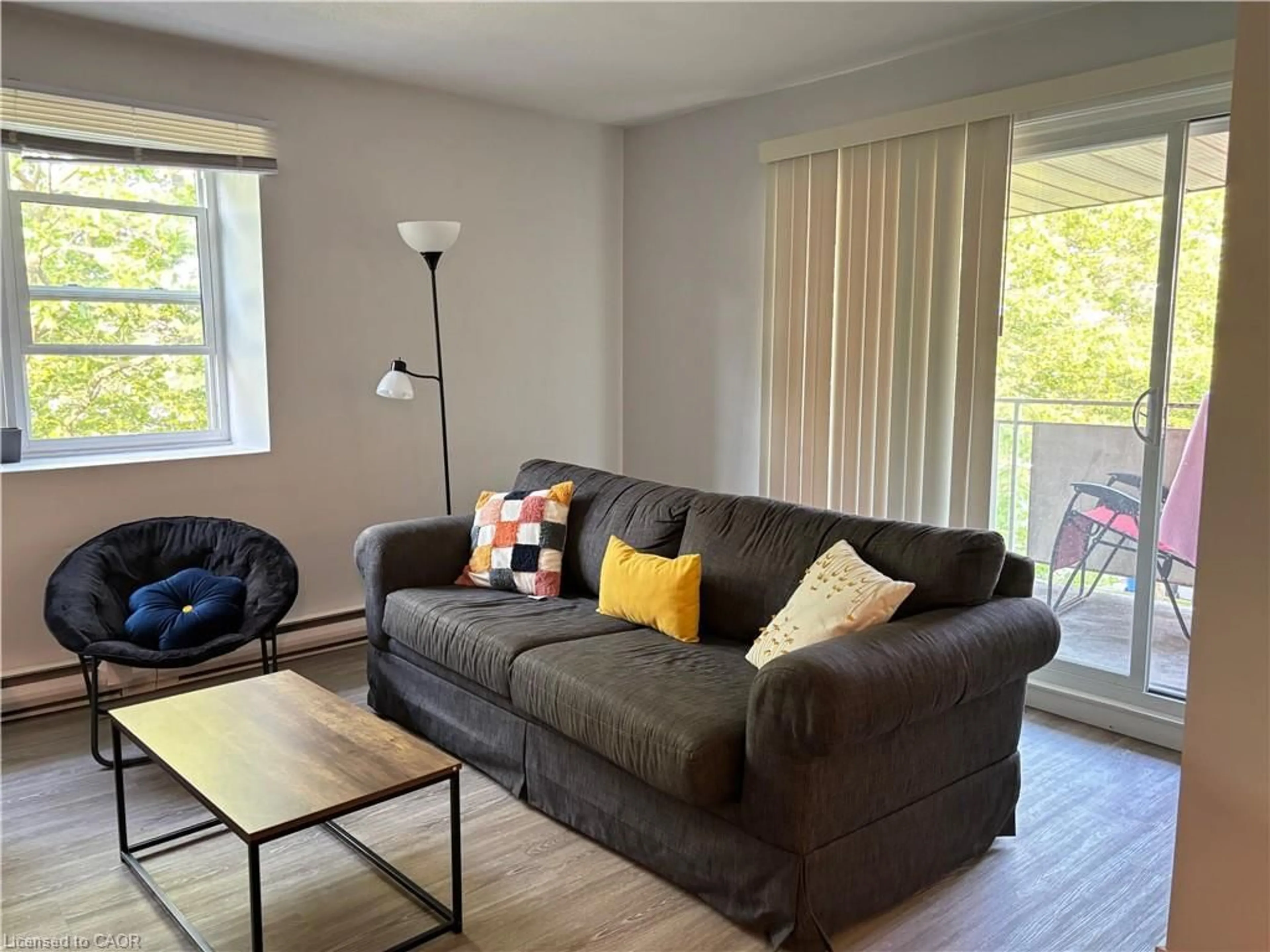 Living room with furniture, wood/laminate floor for 91 Westmount Rd #3, Waterloo Ontario N2L 5G5