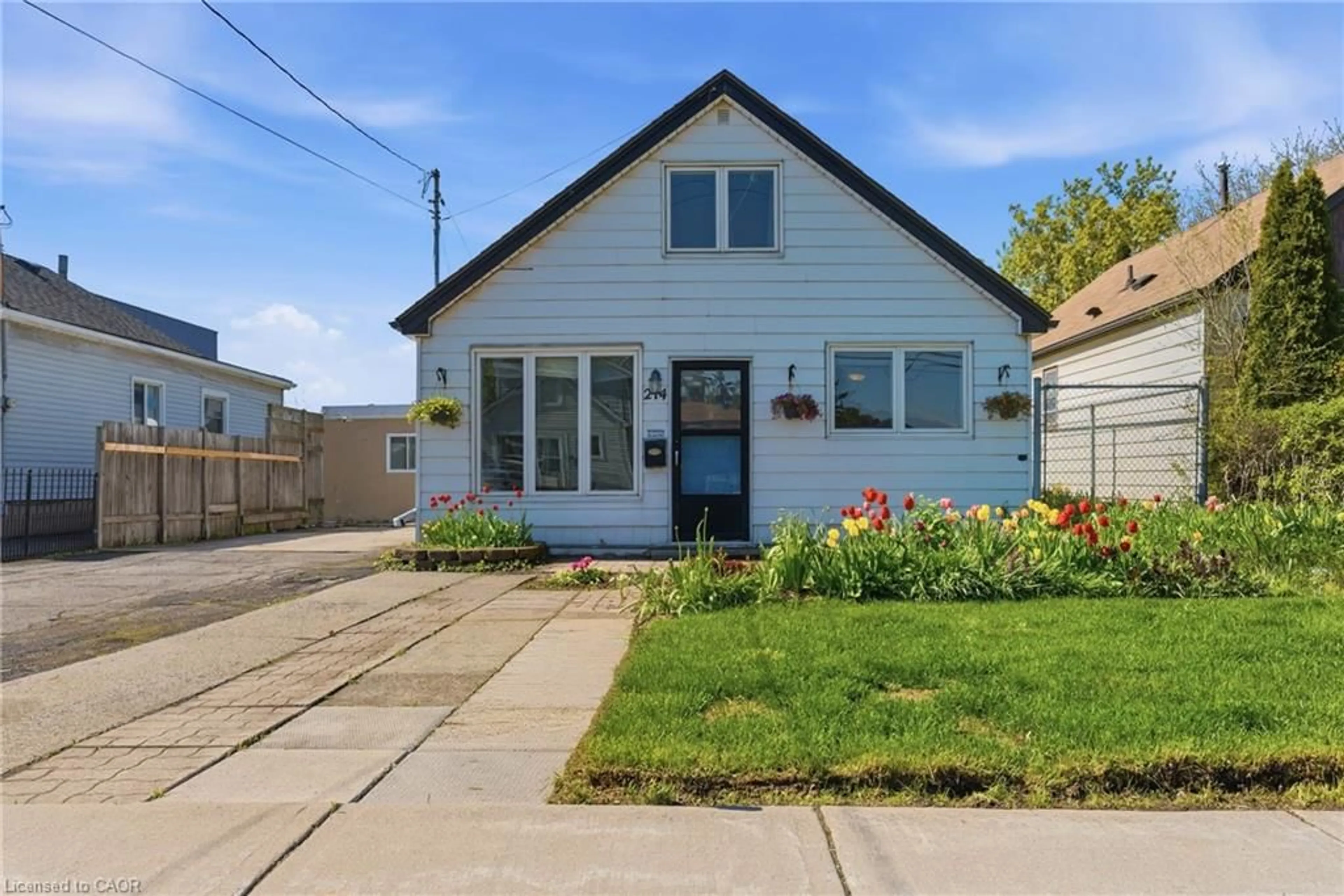 Home with vinyl exterior material, street for 214 Glow Ave, Hamilton Ontario L8H 3W7