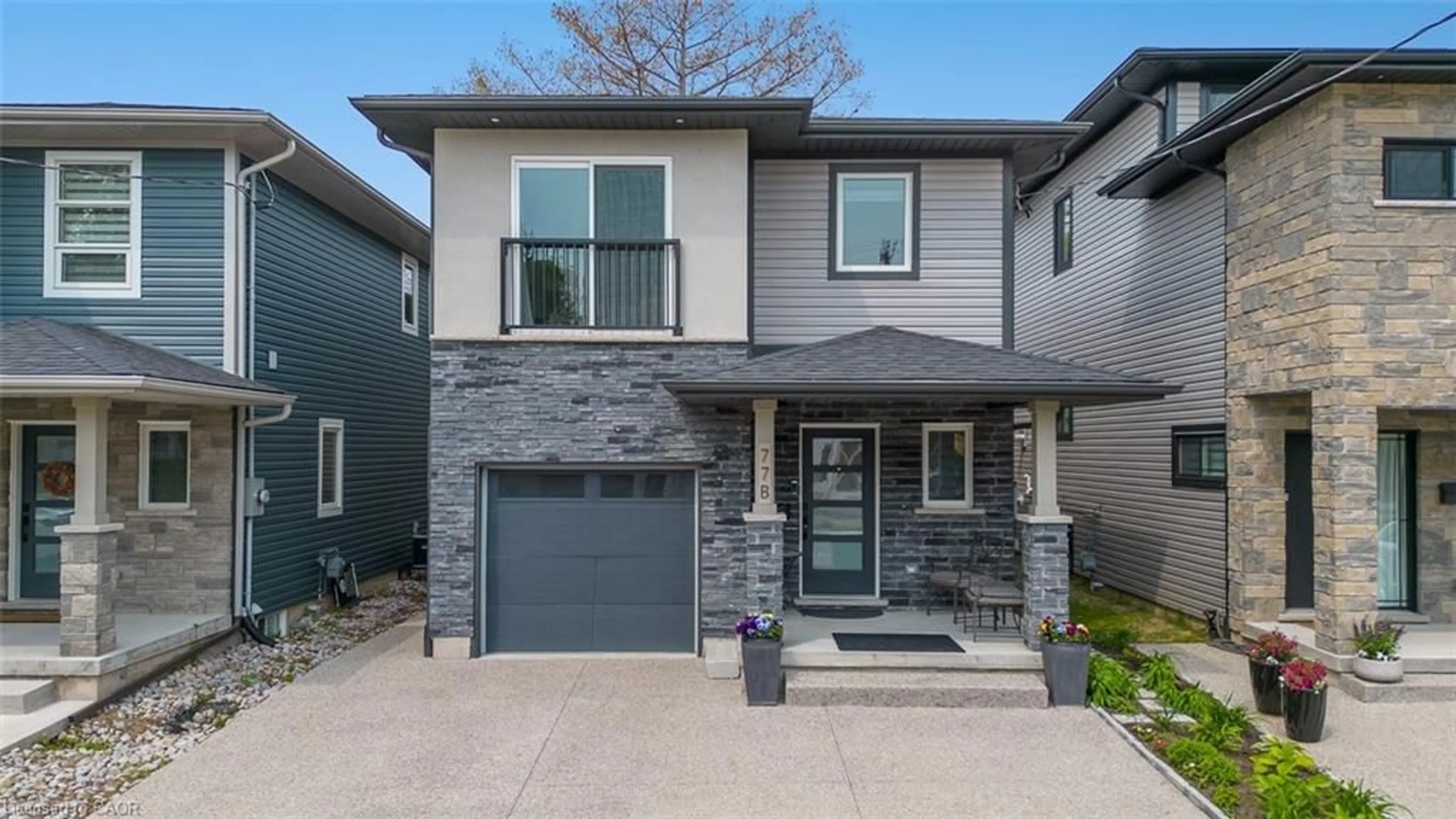 Home with brick exterior material, street for 77 B Broadway Ave, St. Catharines Ontario L2M 7Y3