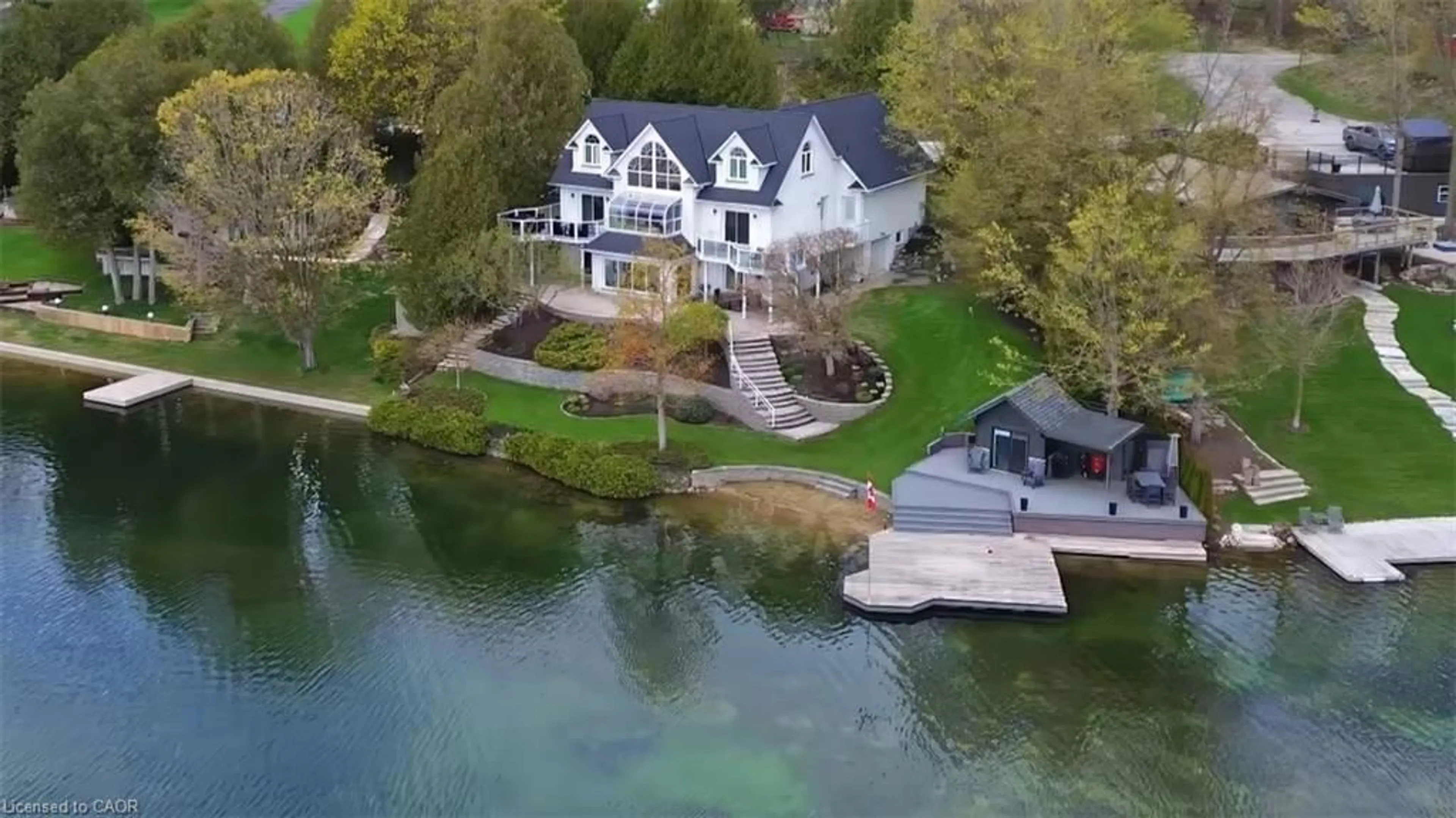 A pic from outside/outdoor area/front of a property/back of a property/a pic from drone, water/lake/river/ocean view for 461 Lake Rosalind Rd 4, Hanover Ontario N4N 3B9