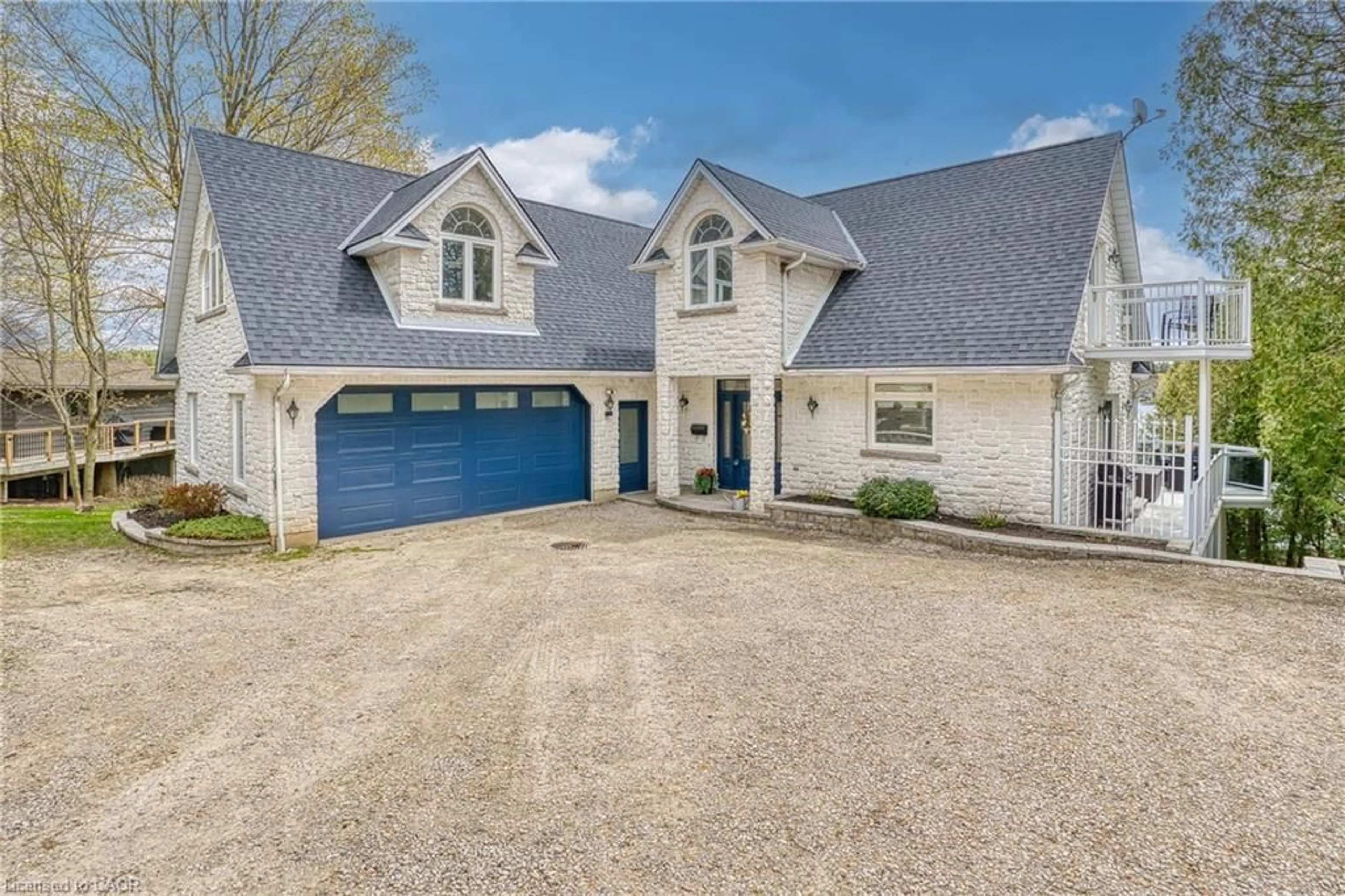 A pic from outside/outdoor area/front of a property/back of a property/a pic from drone, street for 461 Lake Rosalind Rd 4, Hanover Ontario N4N 3B9