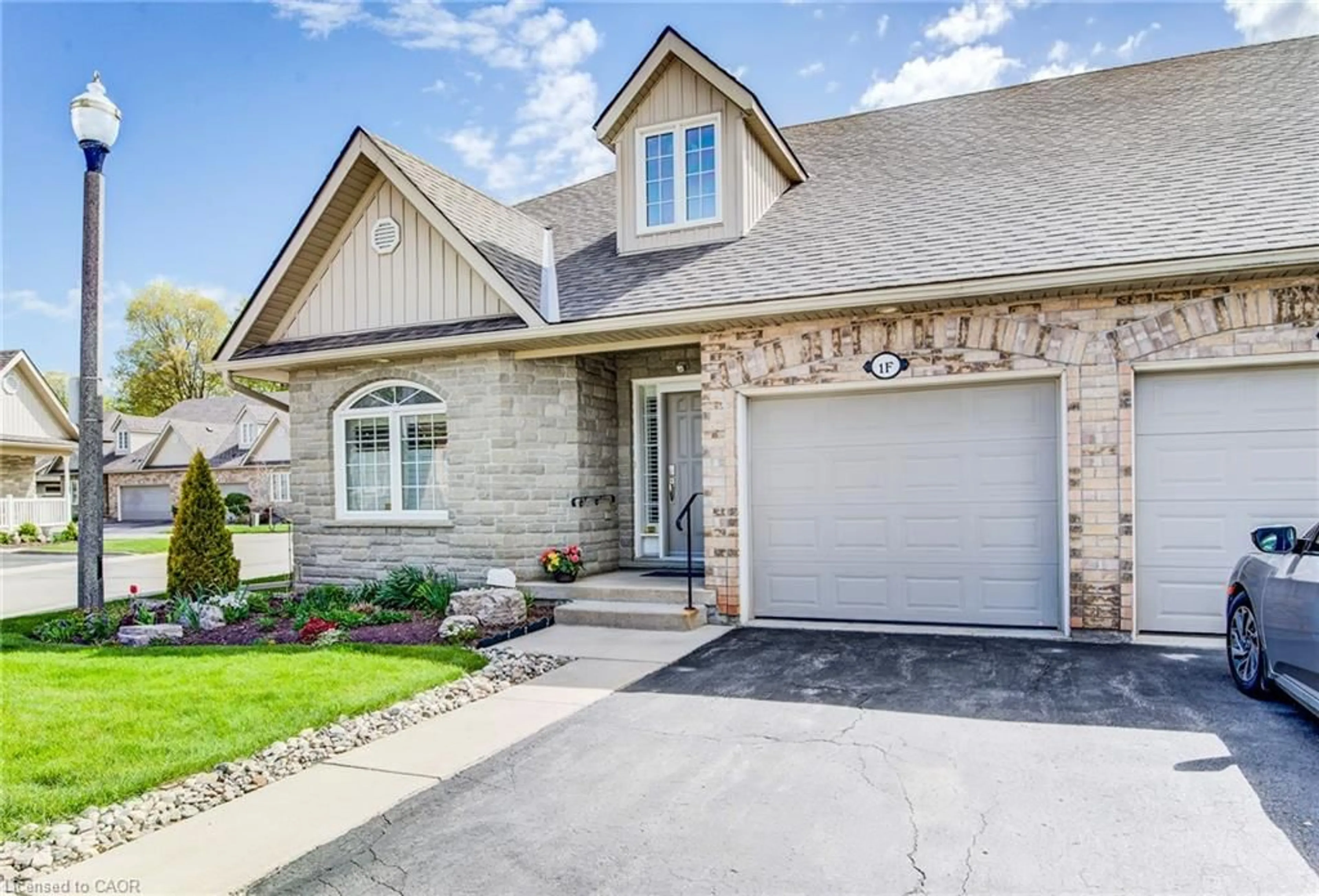 Home with brick exterior material, street for 350 Doon Valley Dr #1F, Kitchener Ontario N2P 3M9