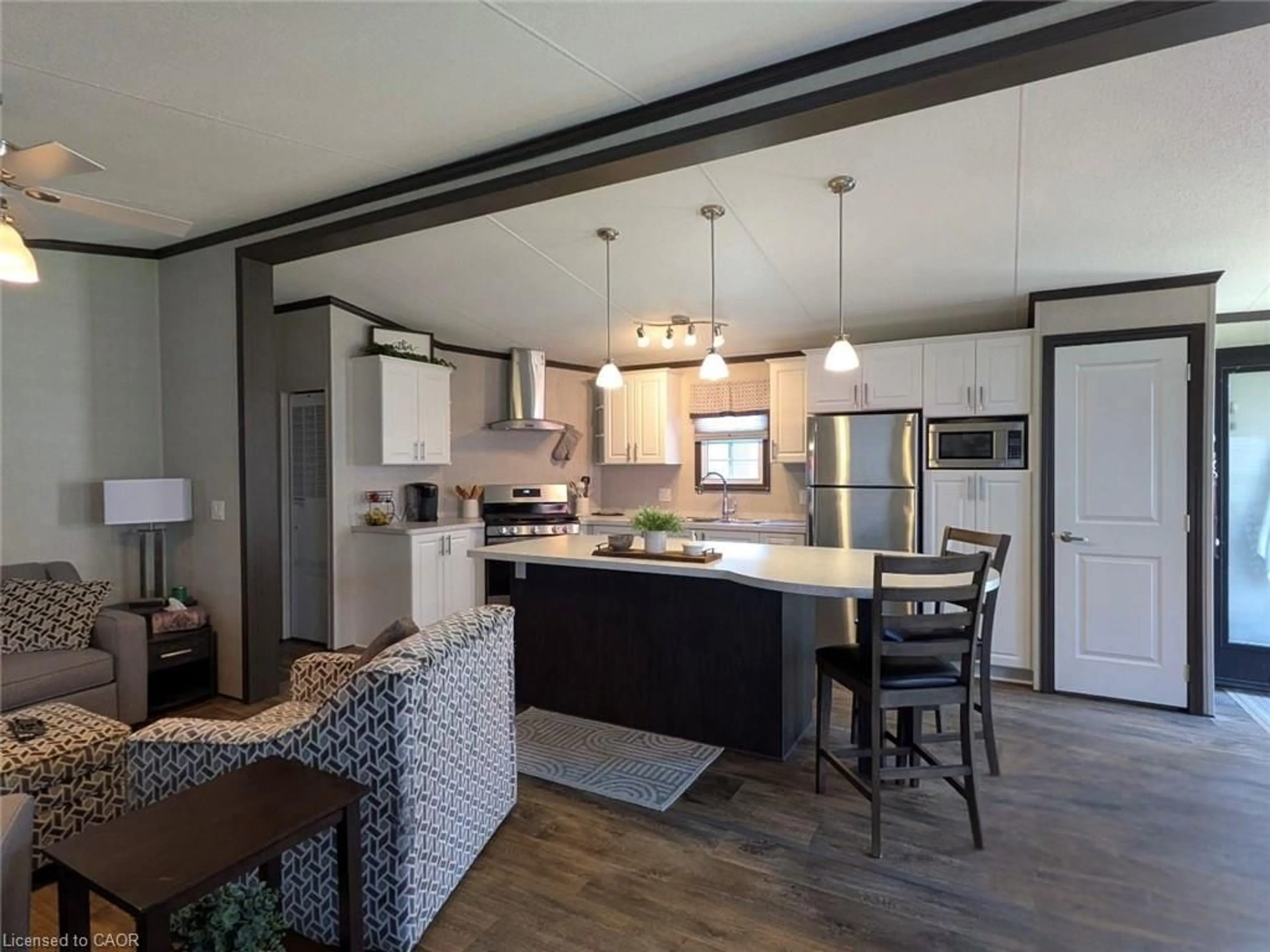 Open concept kitchen, wood/laminate floor for 1235 Villiers Line #CHYHILL054, Keene Ontario K0L 2G0