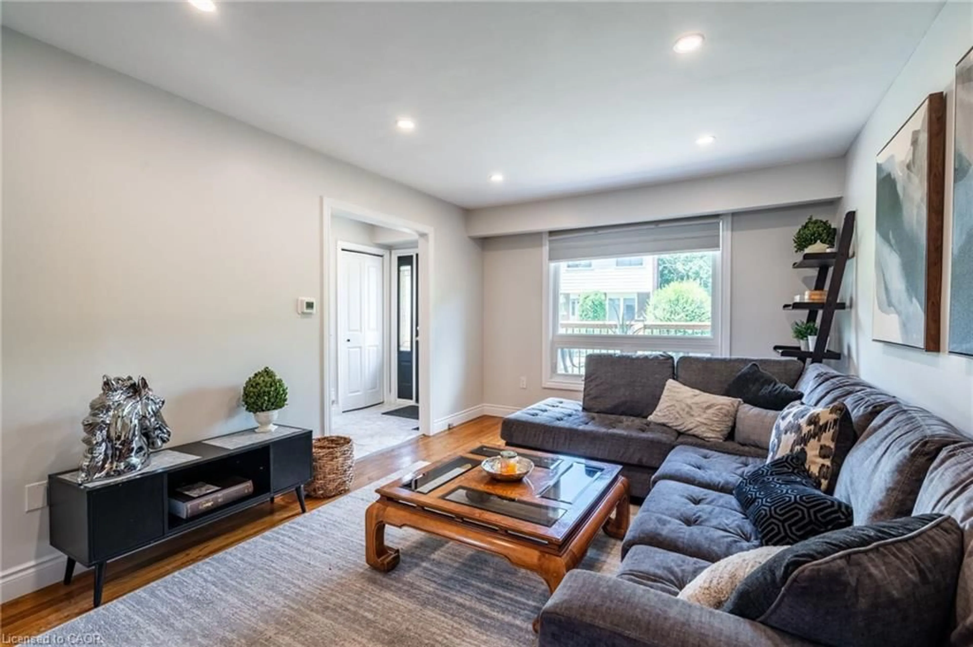 Living room with furniture, wood/laminate floor for 199 York Rd #15, Dundas Ontario L9H 1M9