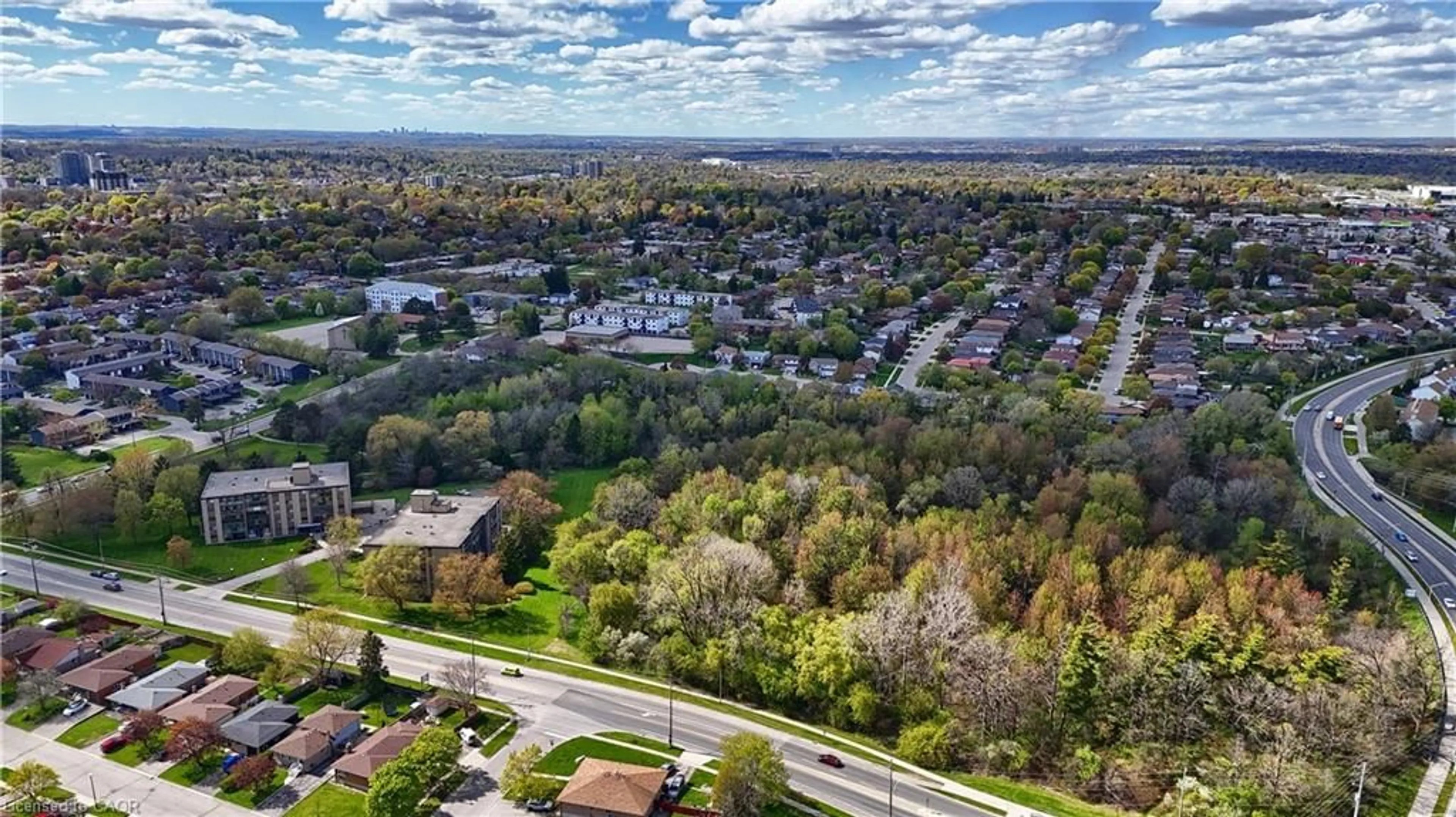 A pic from outside/outdoor area/front of a property/back of a property/a pic from drone, unknown for 400 Champlain Blvd #404, Cambridge Ontario N1R 7J6