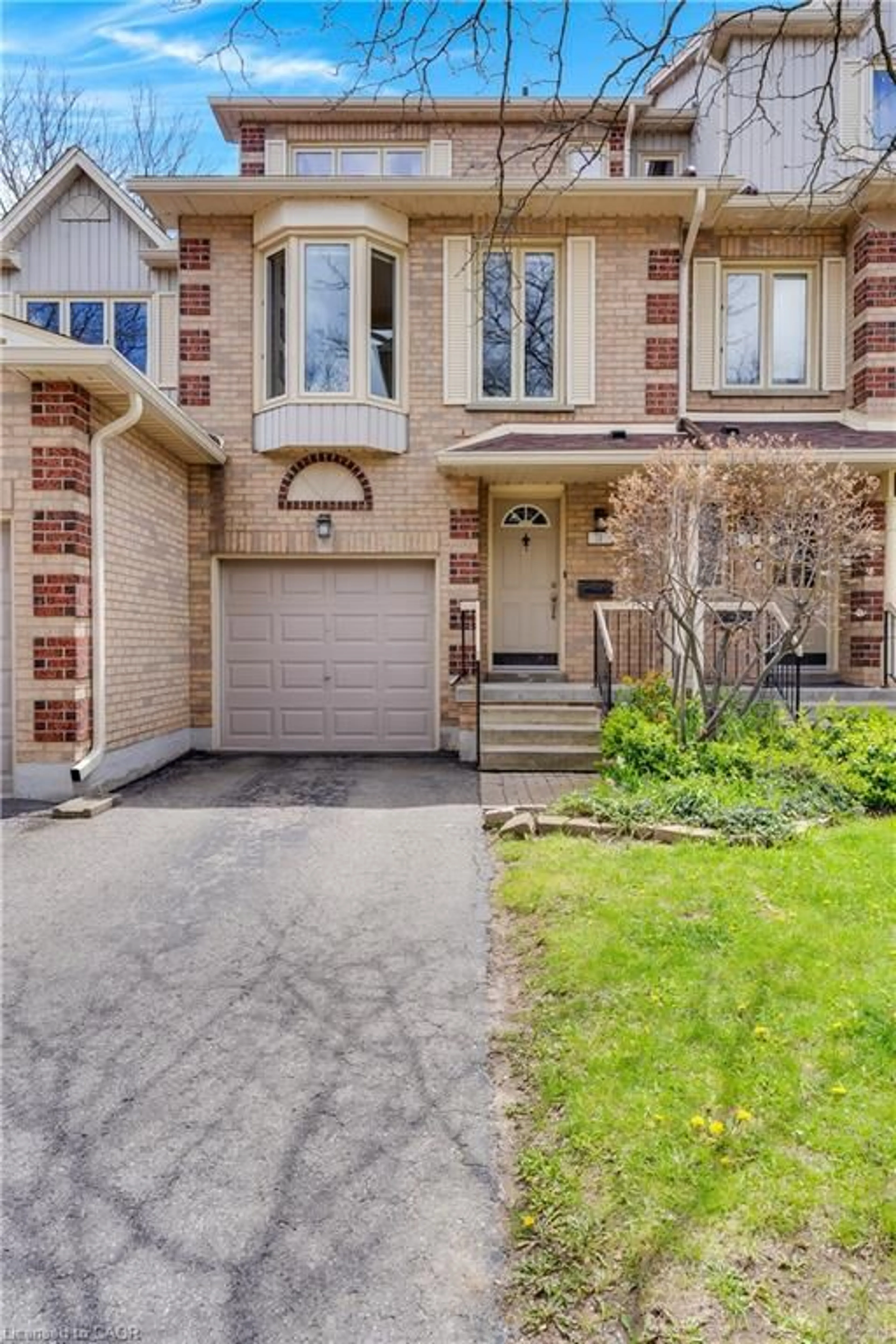 Home with brick exterior material, street for 302 College Ave W #74, Guelph Ontario N1G 4T6