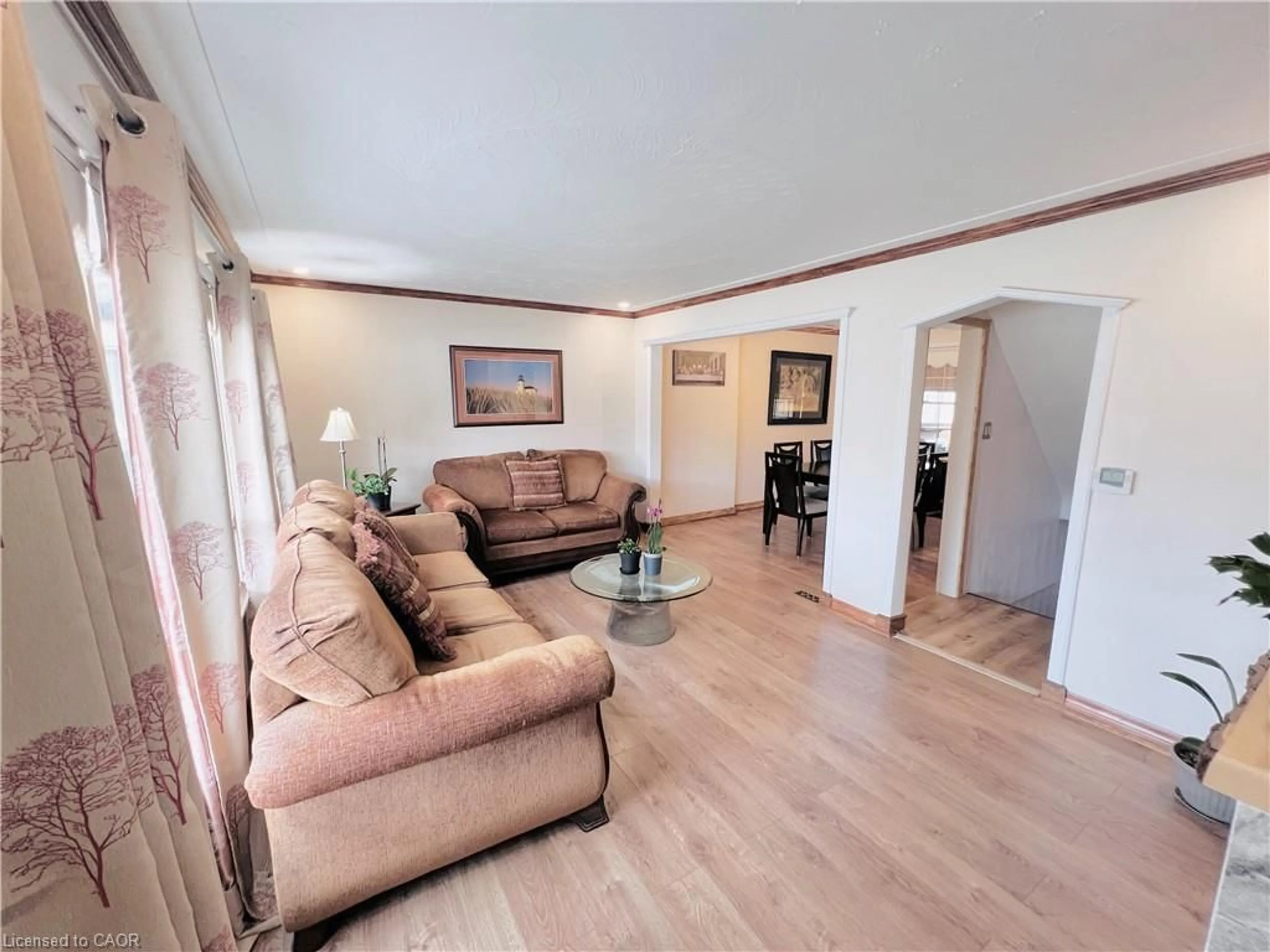 Living room with furniture, wood/laminate floor for 56 Eastvale Pl, Hamilton Ontario L8H 1P1