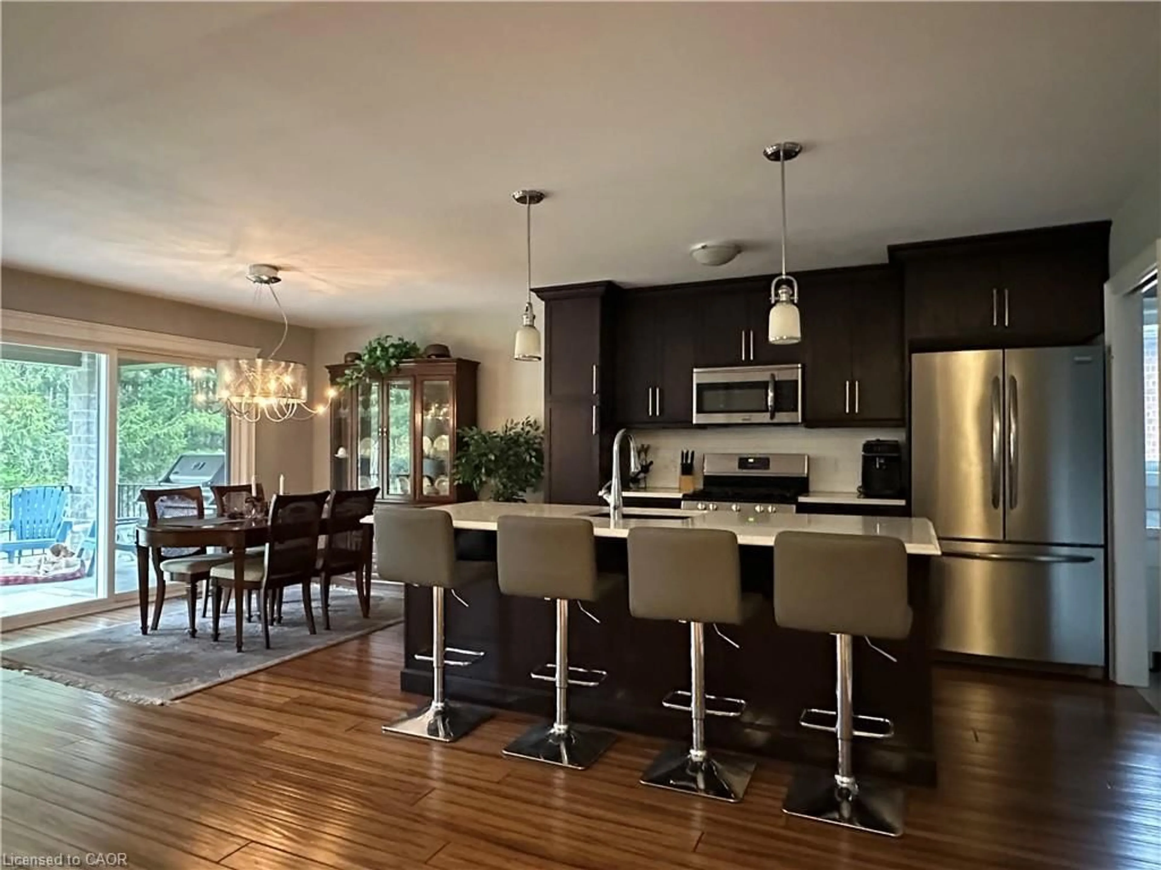 Open concept kitchen, wood/laminate floor for 134 Angler Ave, Port Dover Ontario N0A 1N3