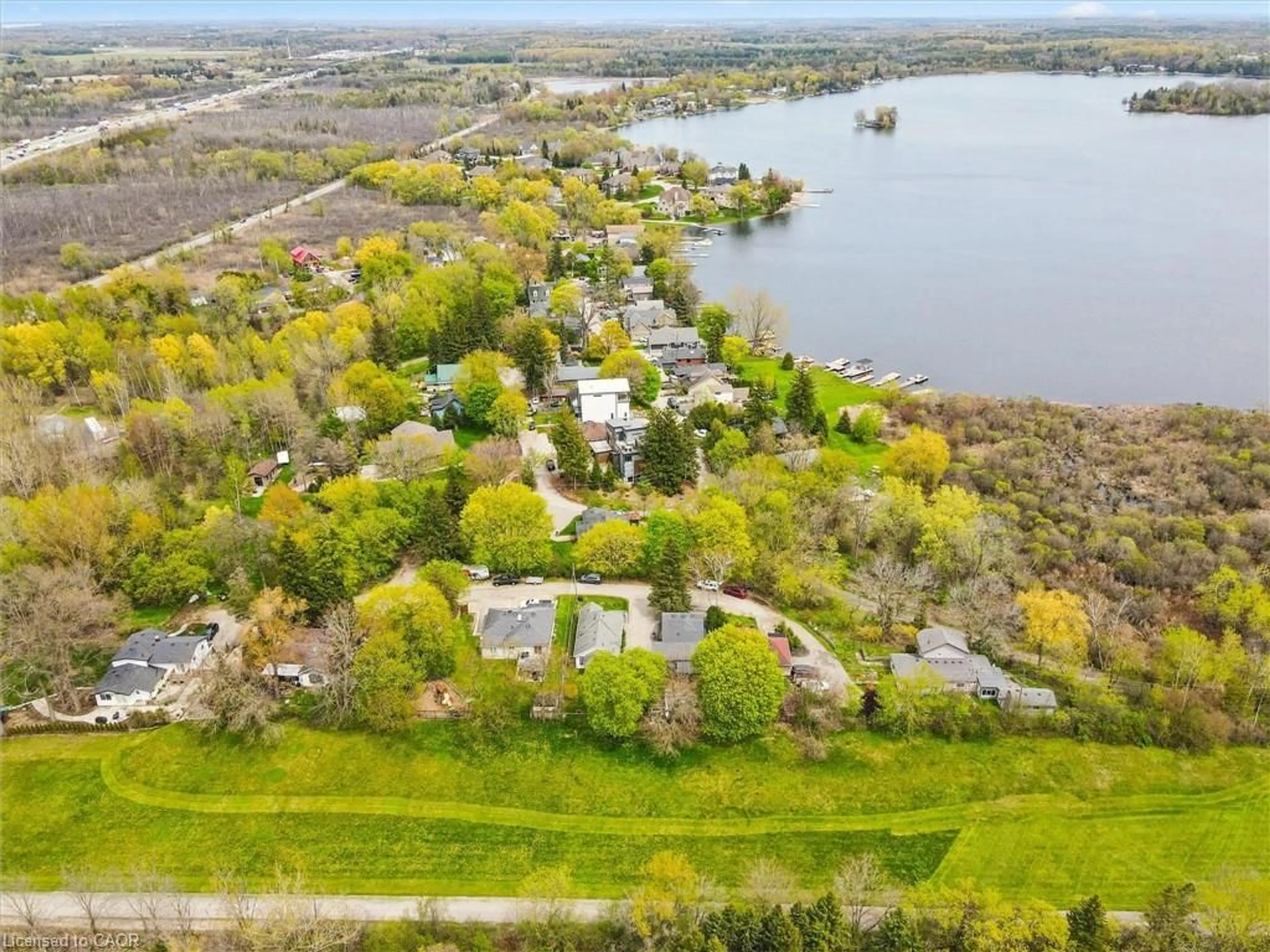A pic from outside/outdoor area/front of a property/back of a property/a pic from drone, water/lake/river/ocean view for 15 Poplar Trail, Puslinch Ontario N3C 2V4
