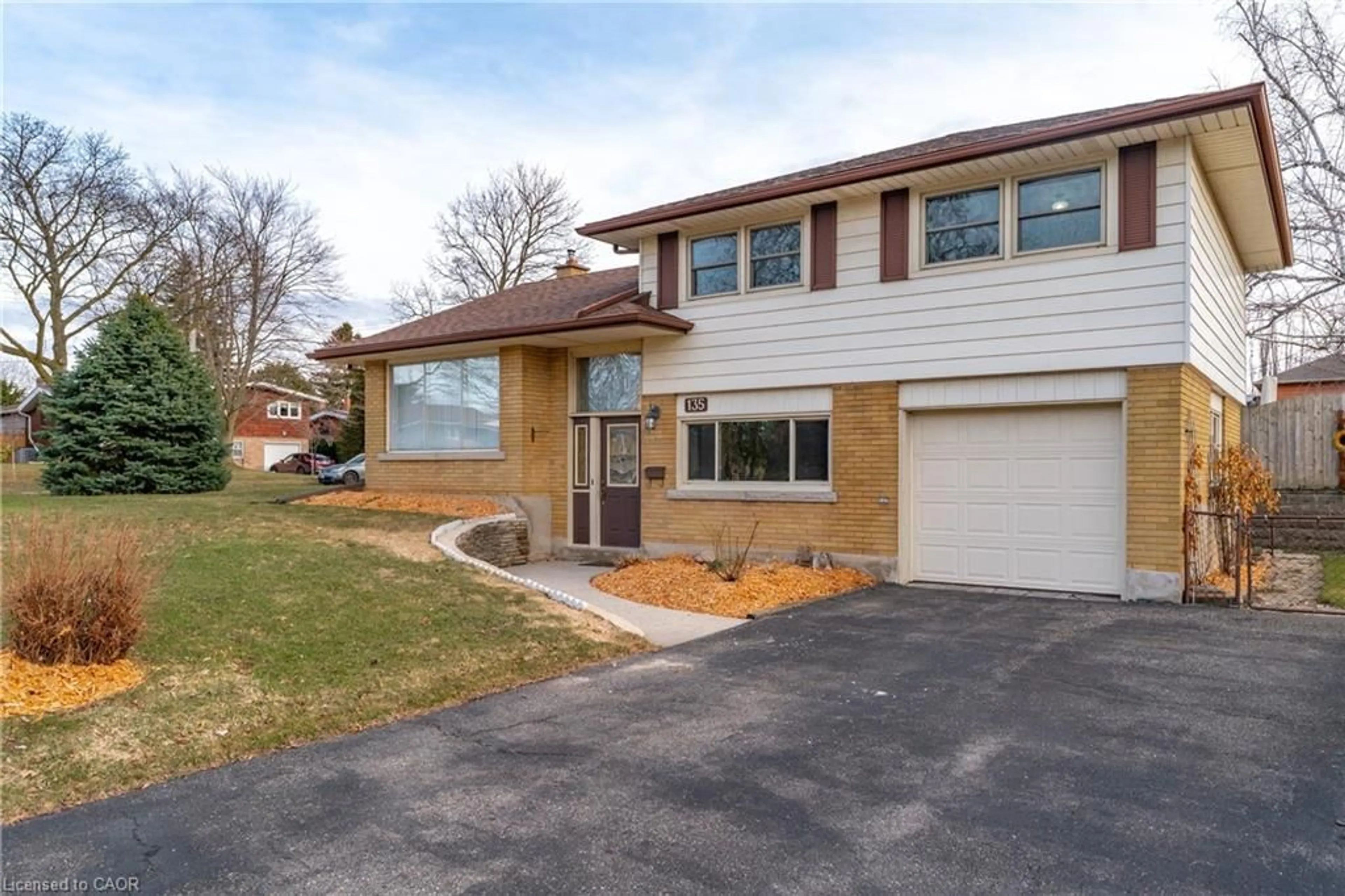 Home with brick exterior material, street for 135 Burbank Rd, Kitchener Ontario N2B 1E3