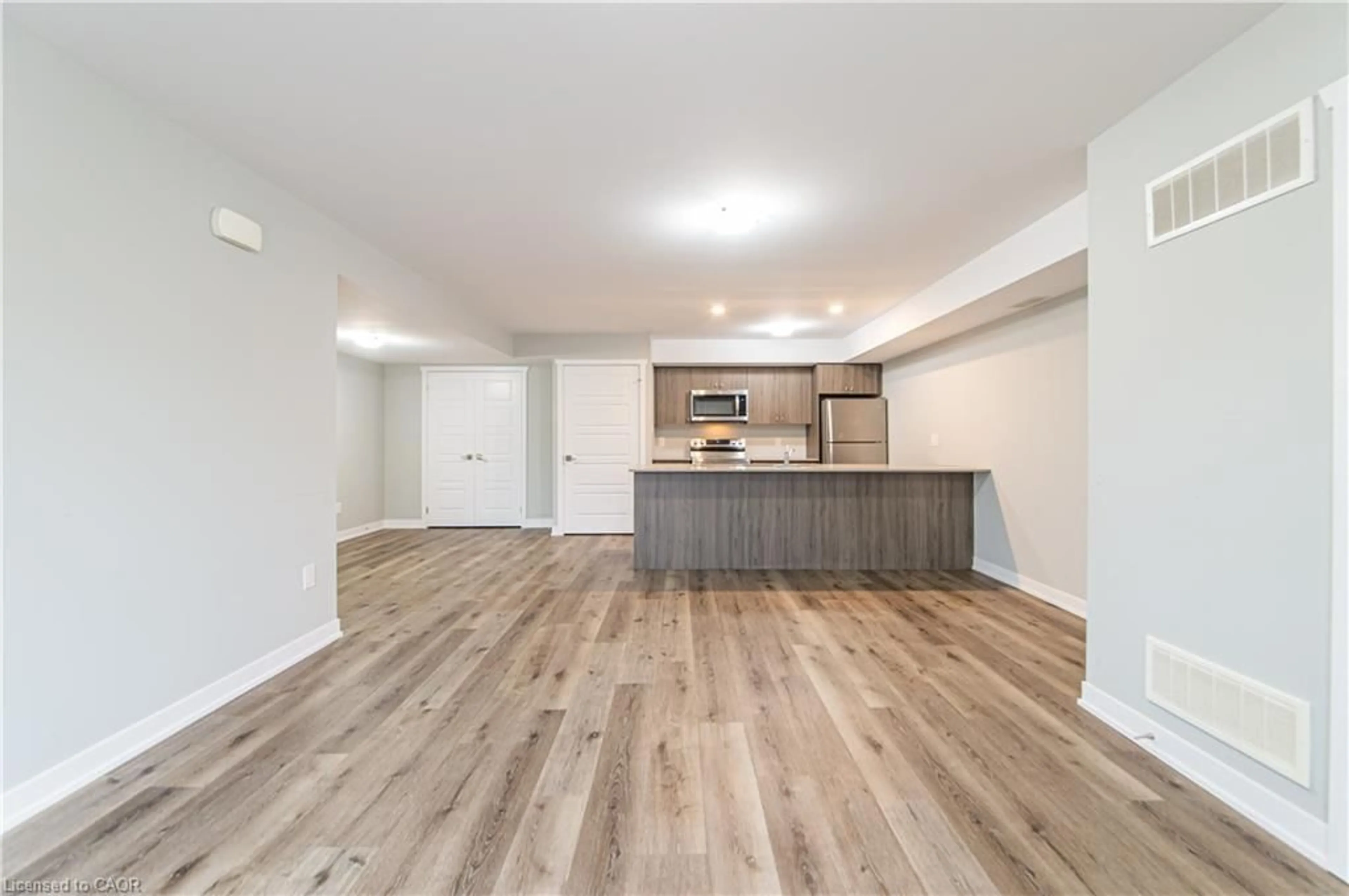 Open concept kitchen, wood/laminate floor for 1331 Countrystone Dr #B9, Kitchener Ontario N2N 3R9