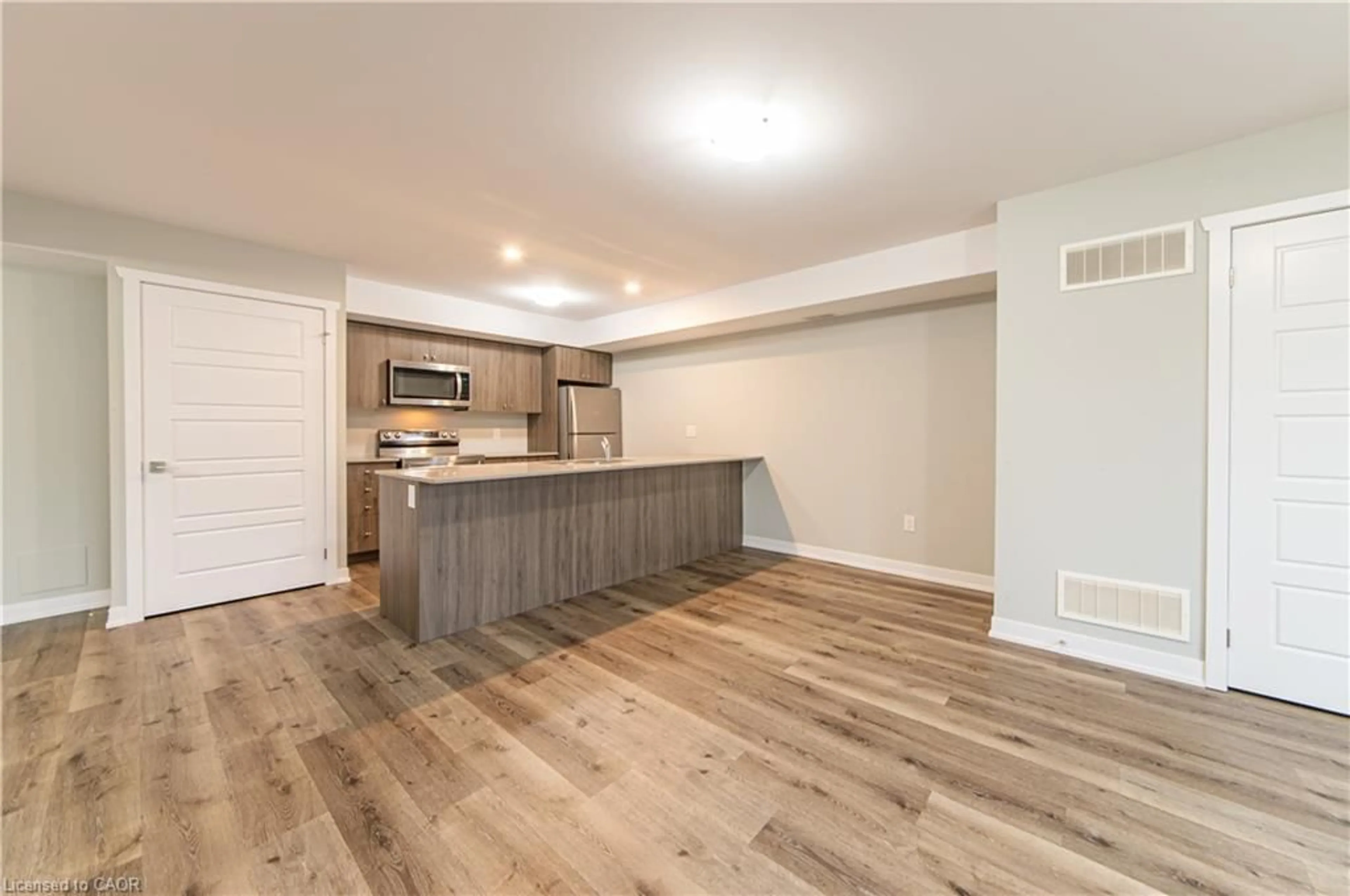 Open concept kitchen, wood/laminate floor for 1331 Countrystone Dr #B9, Kitchener Ontario N2N 3R9