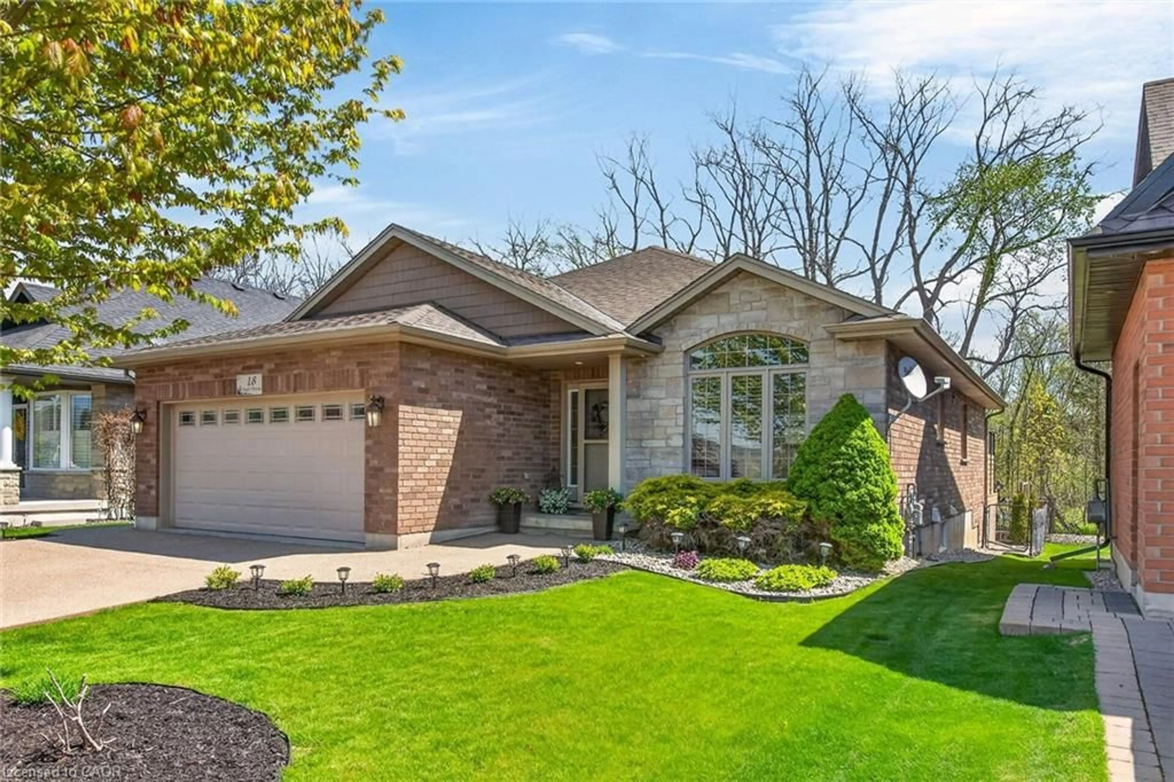 Home with brick exterior material, street for 18 Angler Ave, Port Dover Ontario N0A 1N3