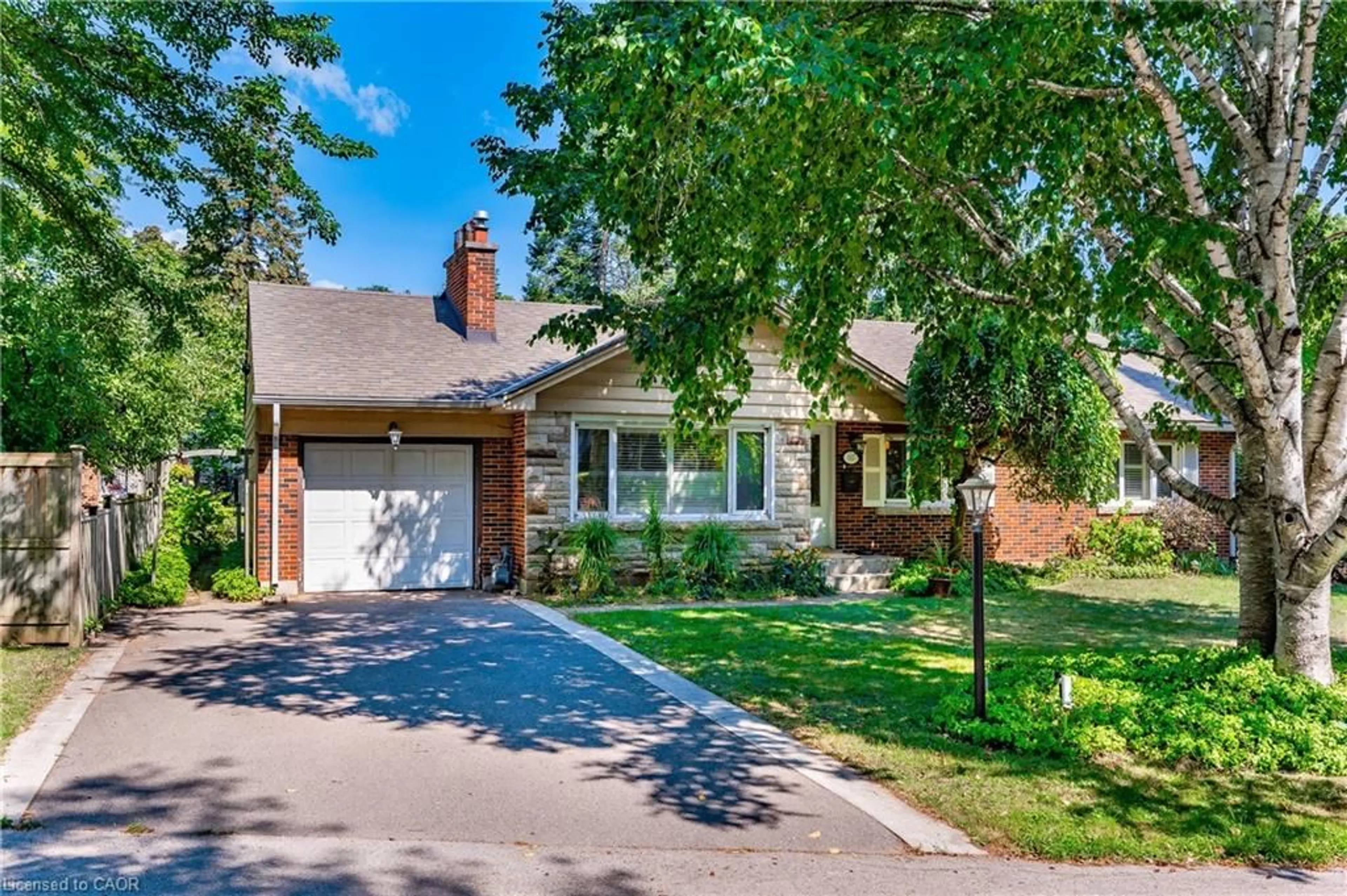 Home with brick exterior material, street for 557 Stillwater Cres, Burlington Ontario L7T 3M8