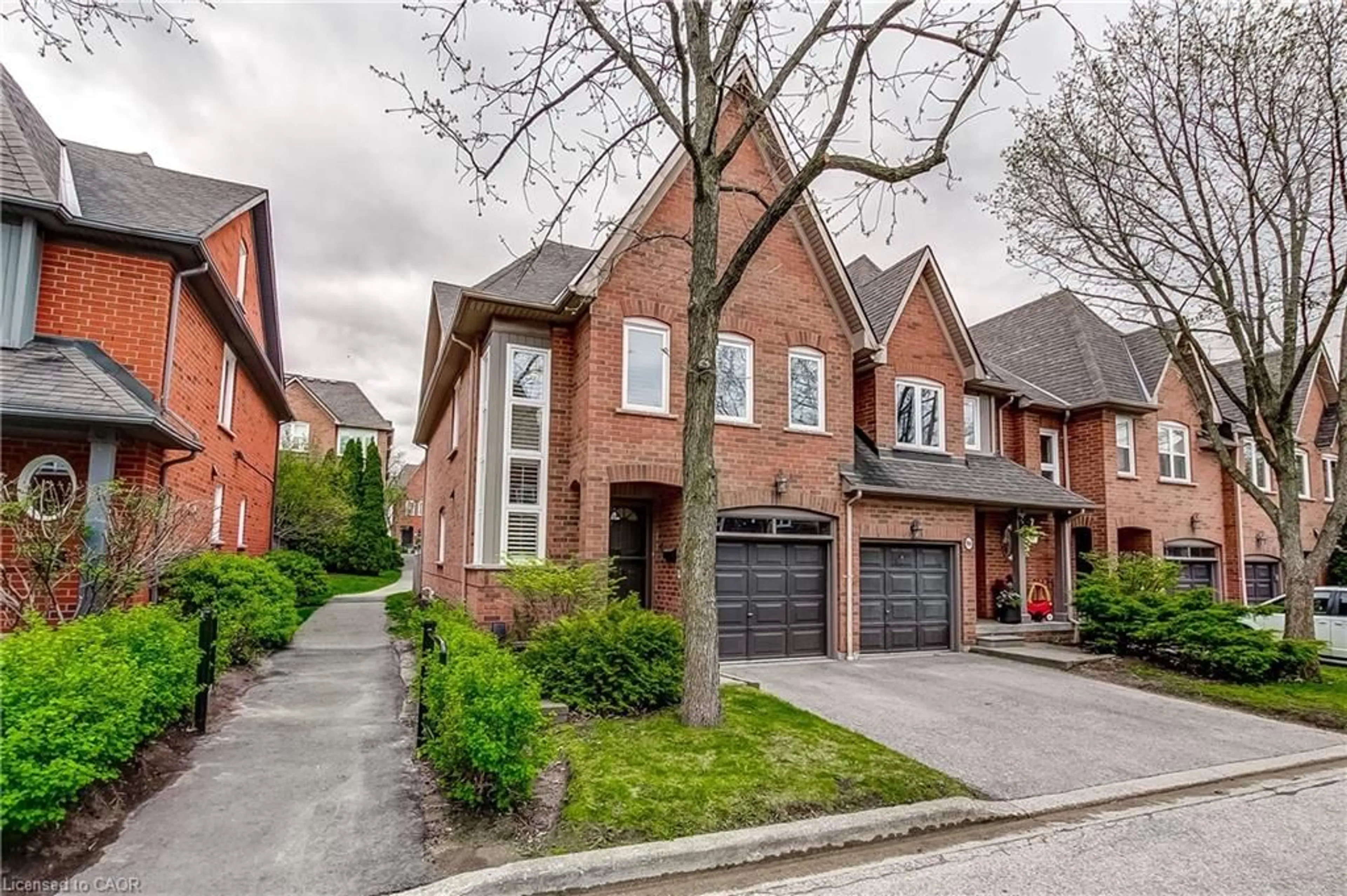 Home with brick exterior material, street for 1084 Queen St #8B, Mississauga Ontario L5H 4K4