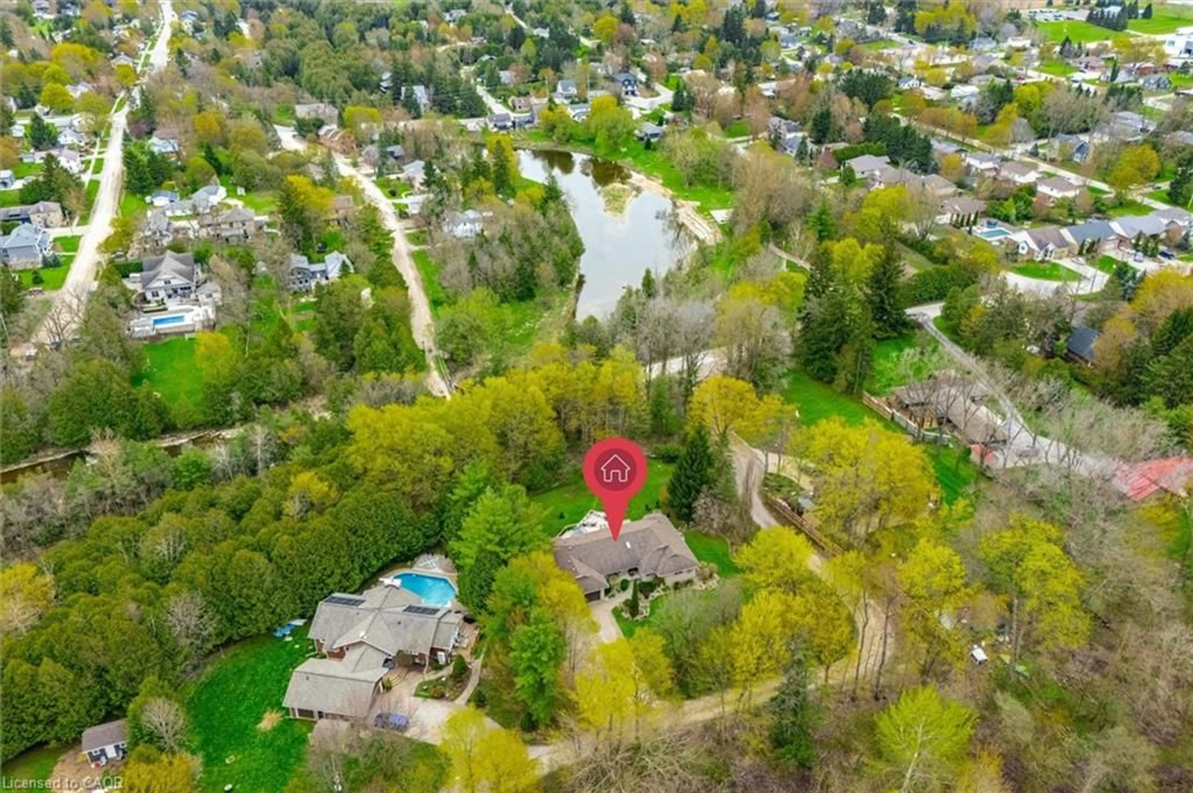 A pic from outside/outdoor area/front of a property/back of a property/a pic from drone, water/lake/river/ocean view for 25 Riverview Dr, Elora Ontario N0B 1S0