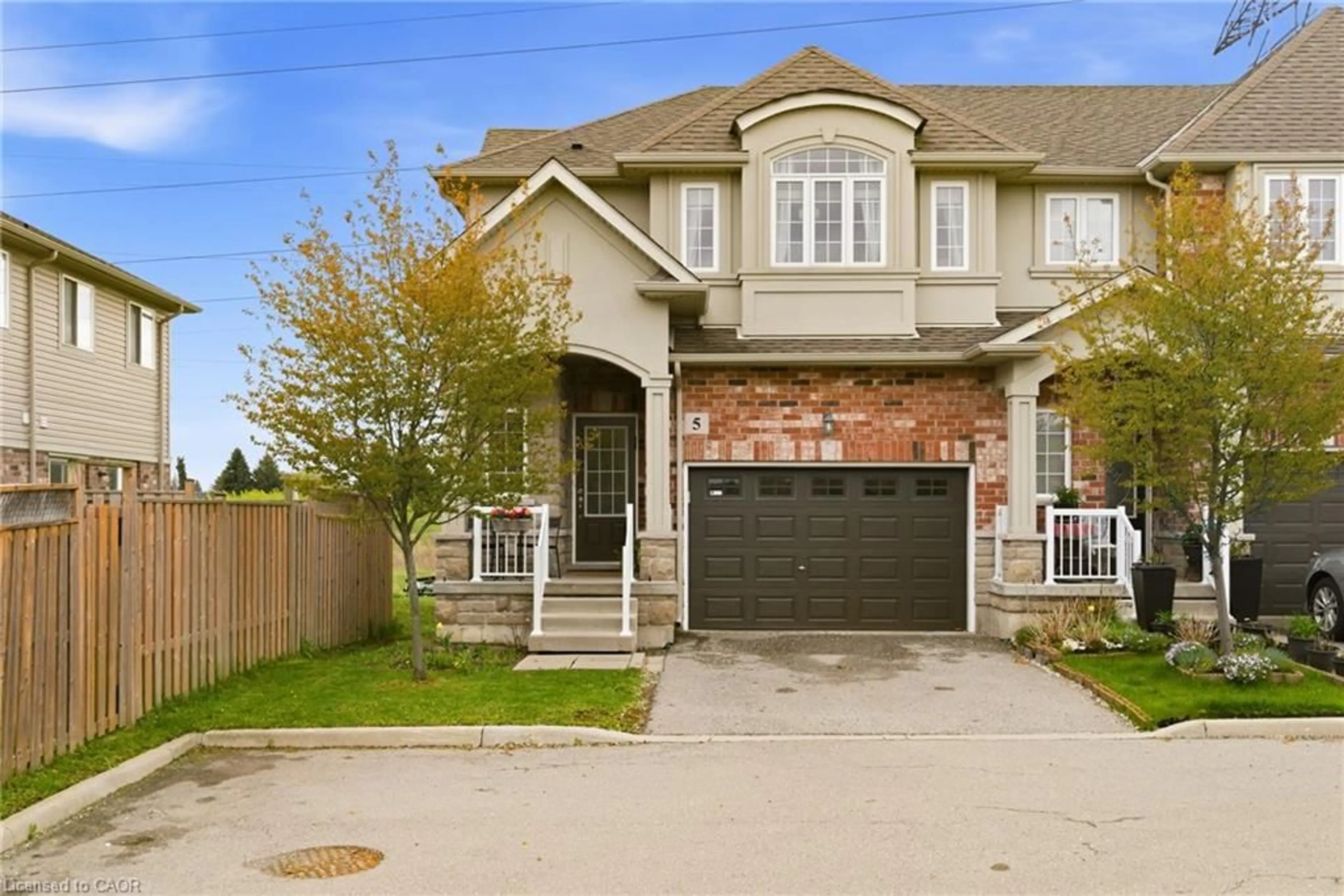 Home with brick exterior material, street for 73 Medici Lane #5, Hamilton Ontario L9B 0H3