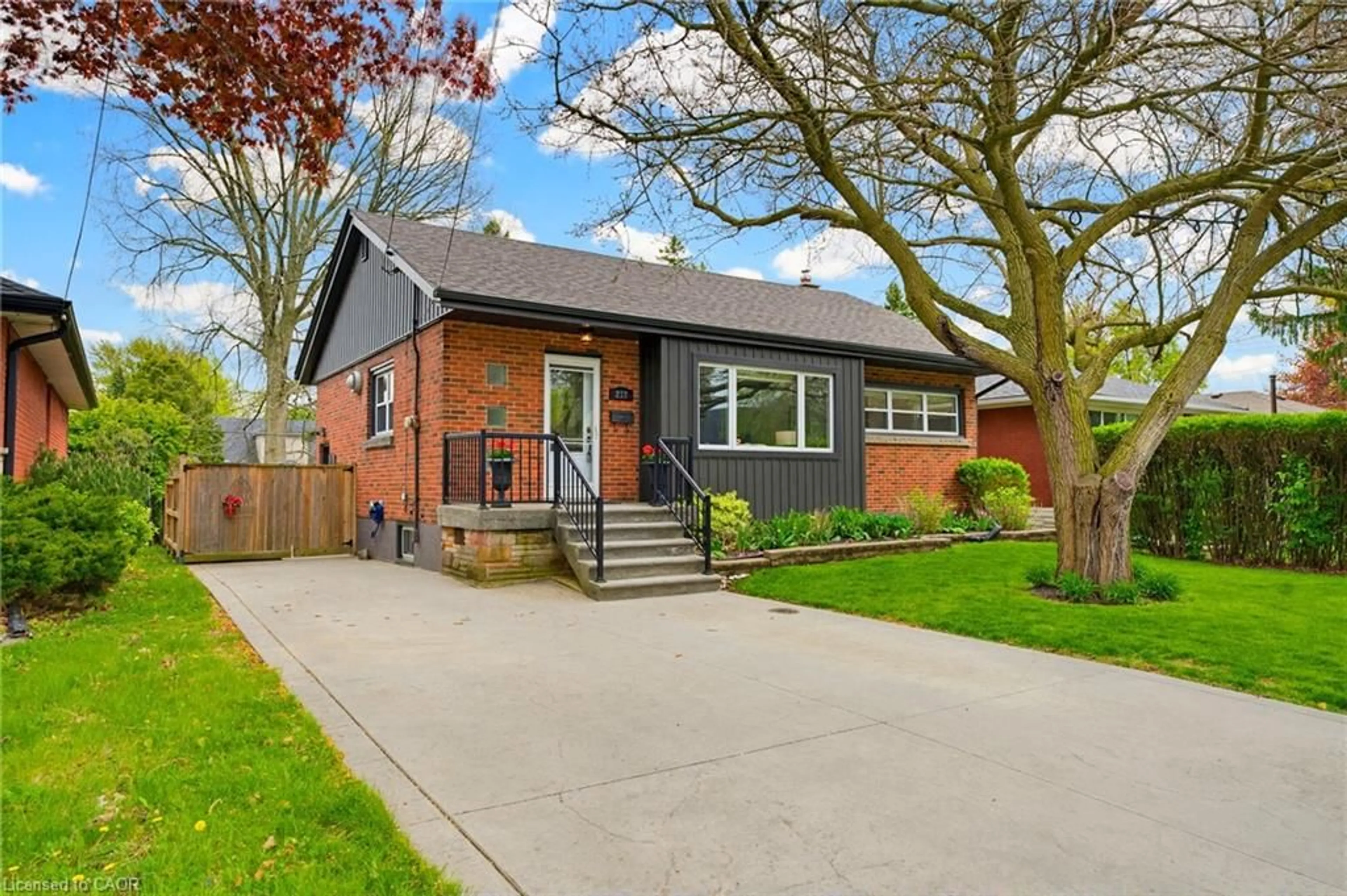 Home with brick exterior material, street for 217 Upper Paradise Rd, Hamilton Ontario L9C 5C1