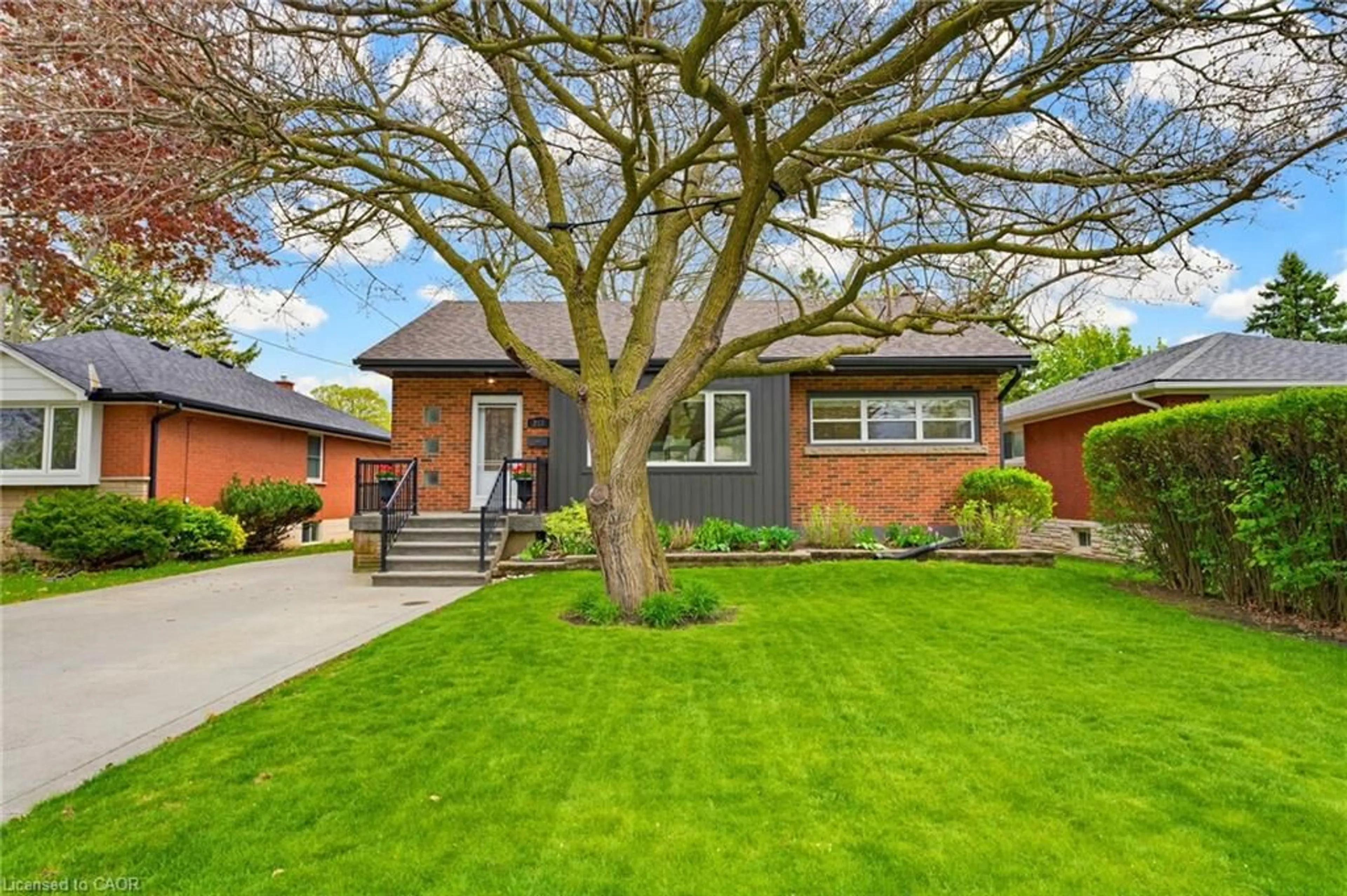 Home with brick exterior material, street for 217 Upper Paradise Rd, Hamilton Ontario L9C 5C1