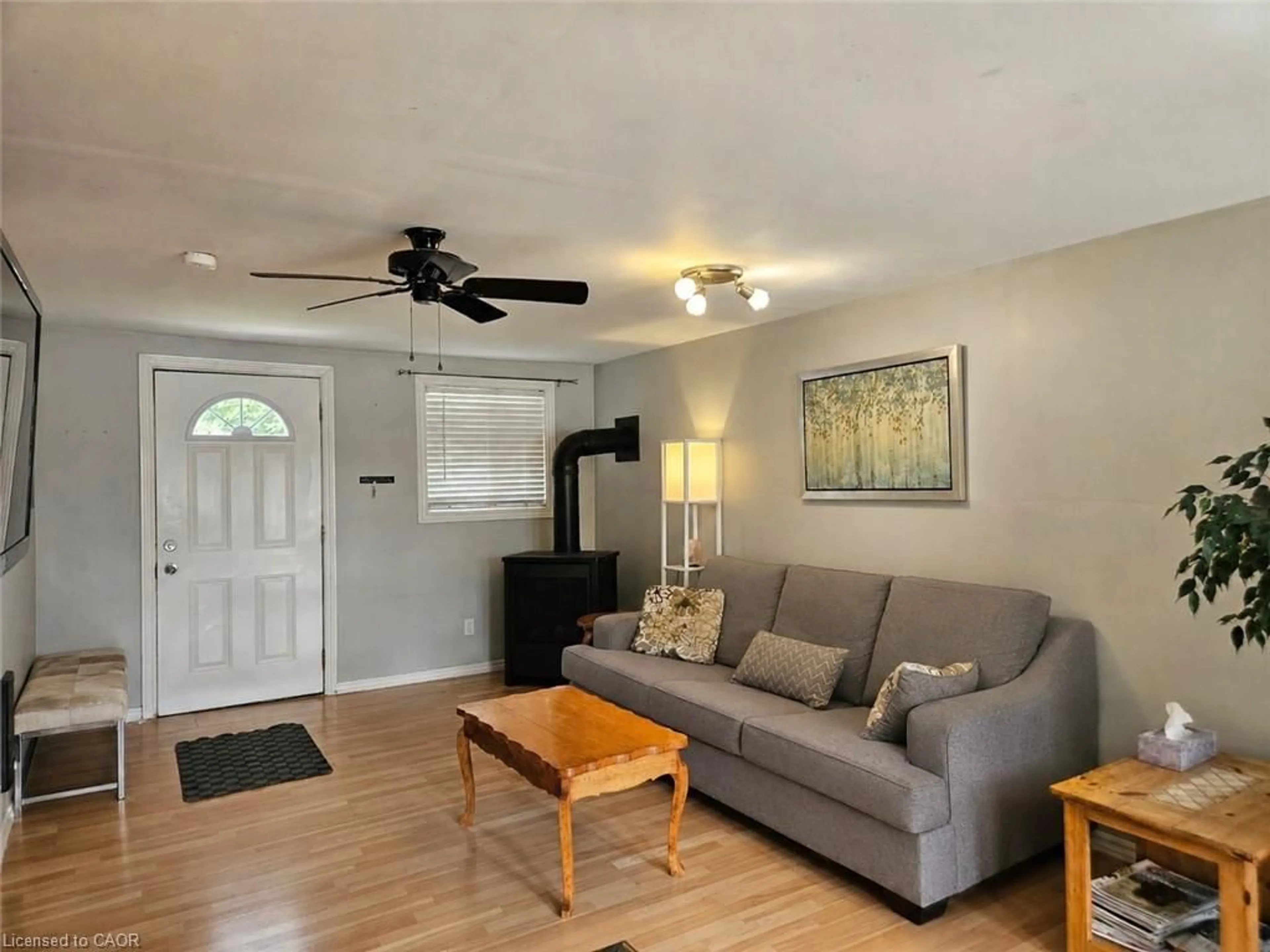 Living room with furniture, wood/laminate floor for 1323 Queen St #125, New Dundee Ontario N0B 2E0