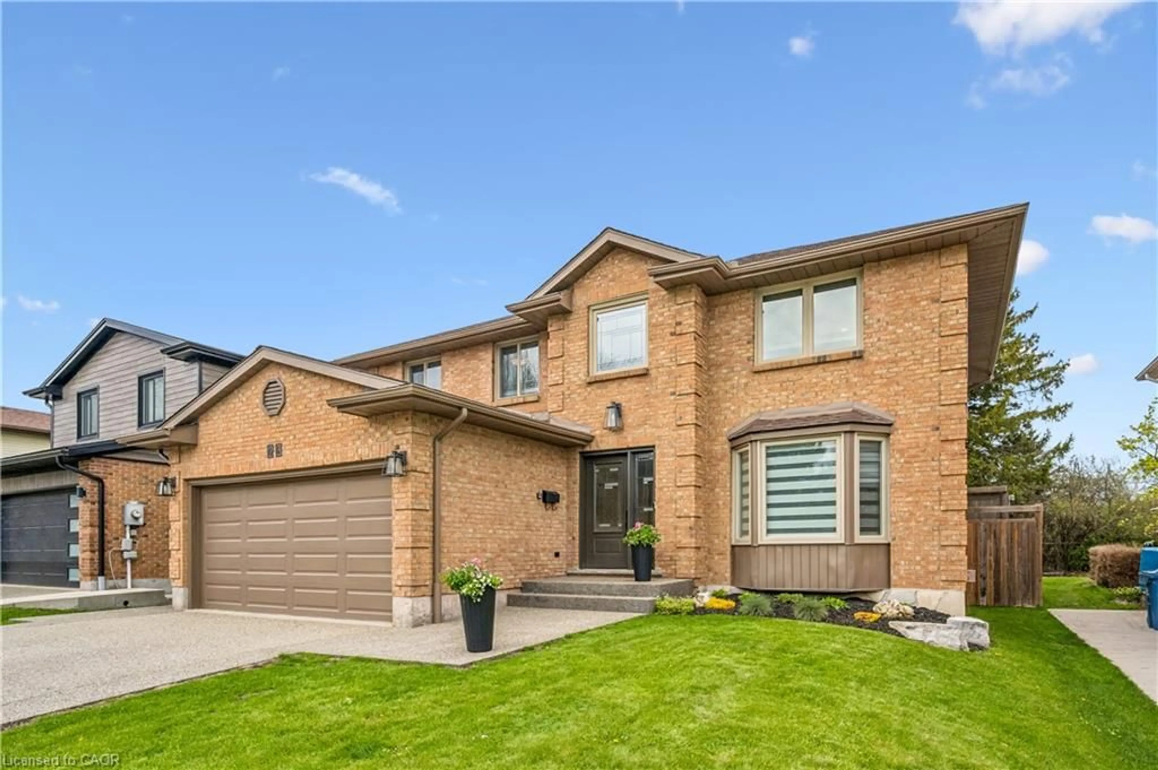 Home with brick exterior material, street for 23 Old Colony Trail, Guelph Ontario N1G 4A4