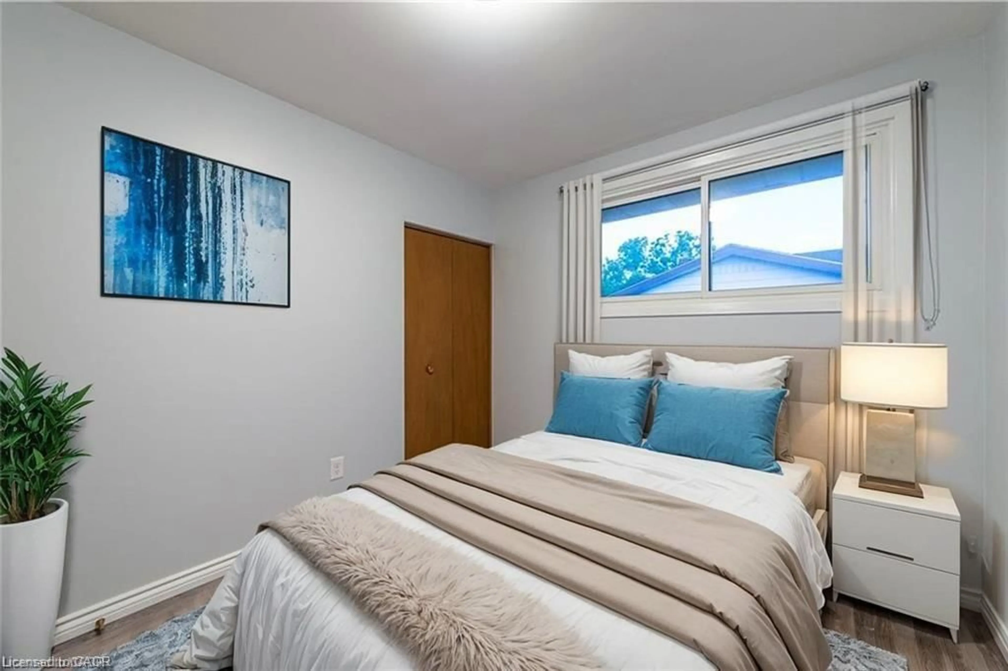 Bedroom with bed, wood/laminate floor for 136 Macgregor Cres, Waterloo Ontario N2J 3W9