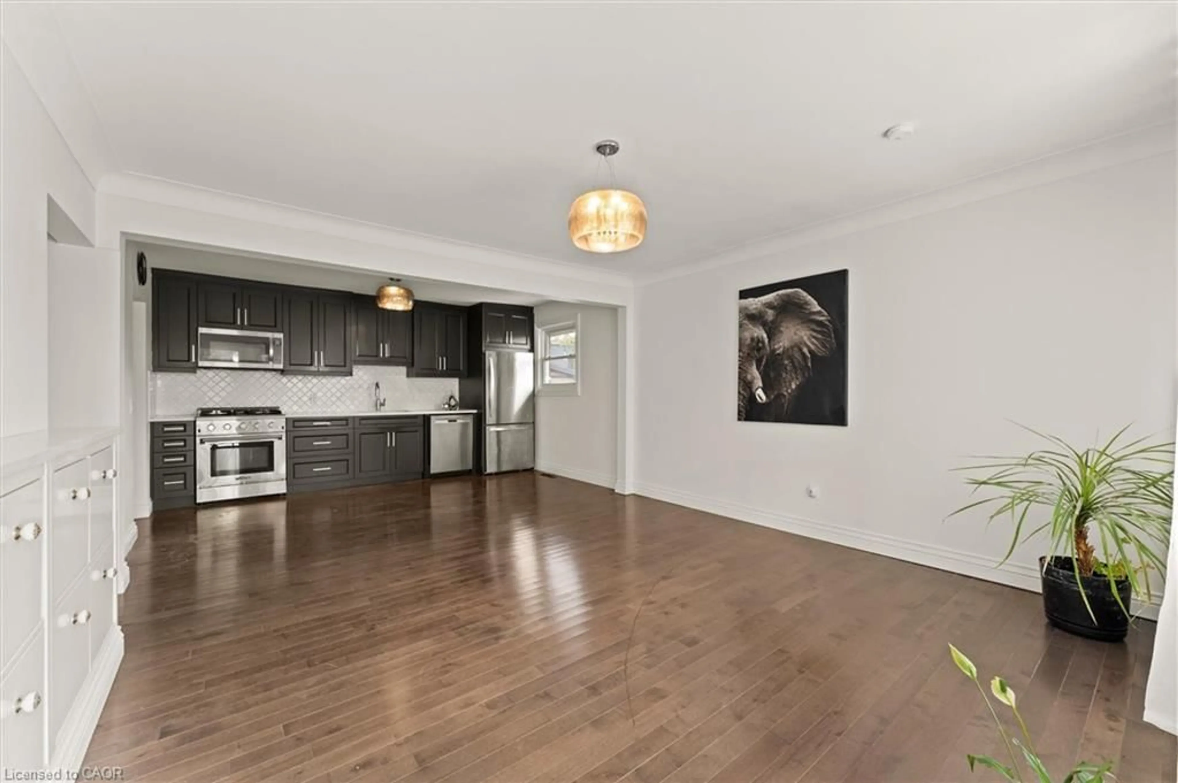 Open concept kitchen, wood/laminate floor for 85 Riverview Ave, LaSalle Ontario N9J 1Z9