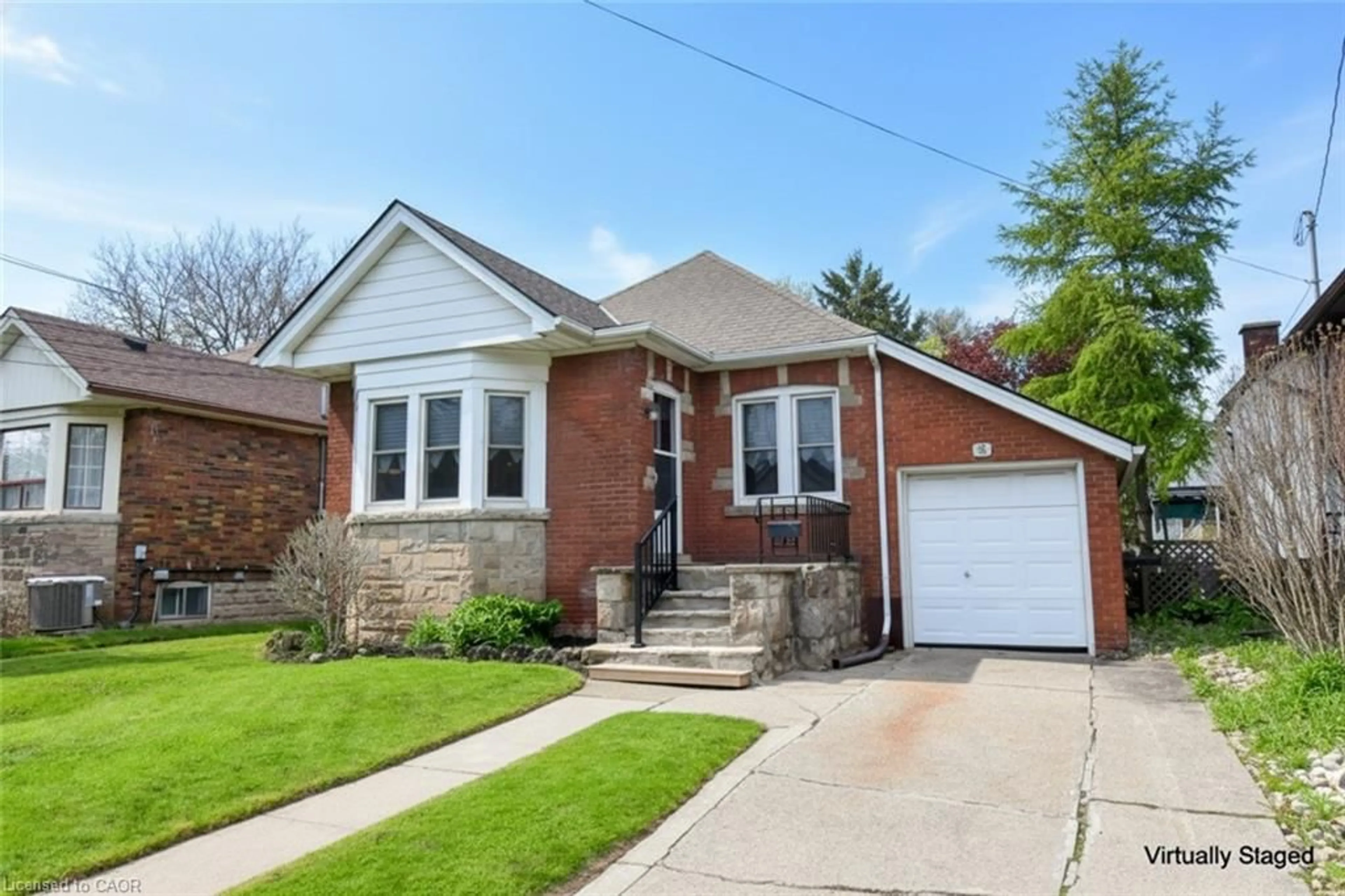 Home with brick exterior material, street for 8 Norwood Rd, Hamilton Ontario L8S 3P9