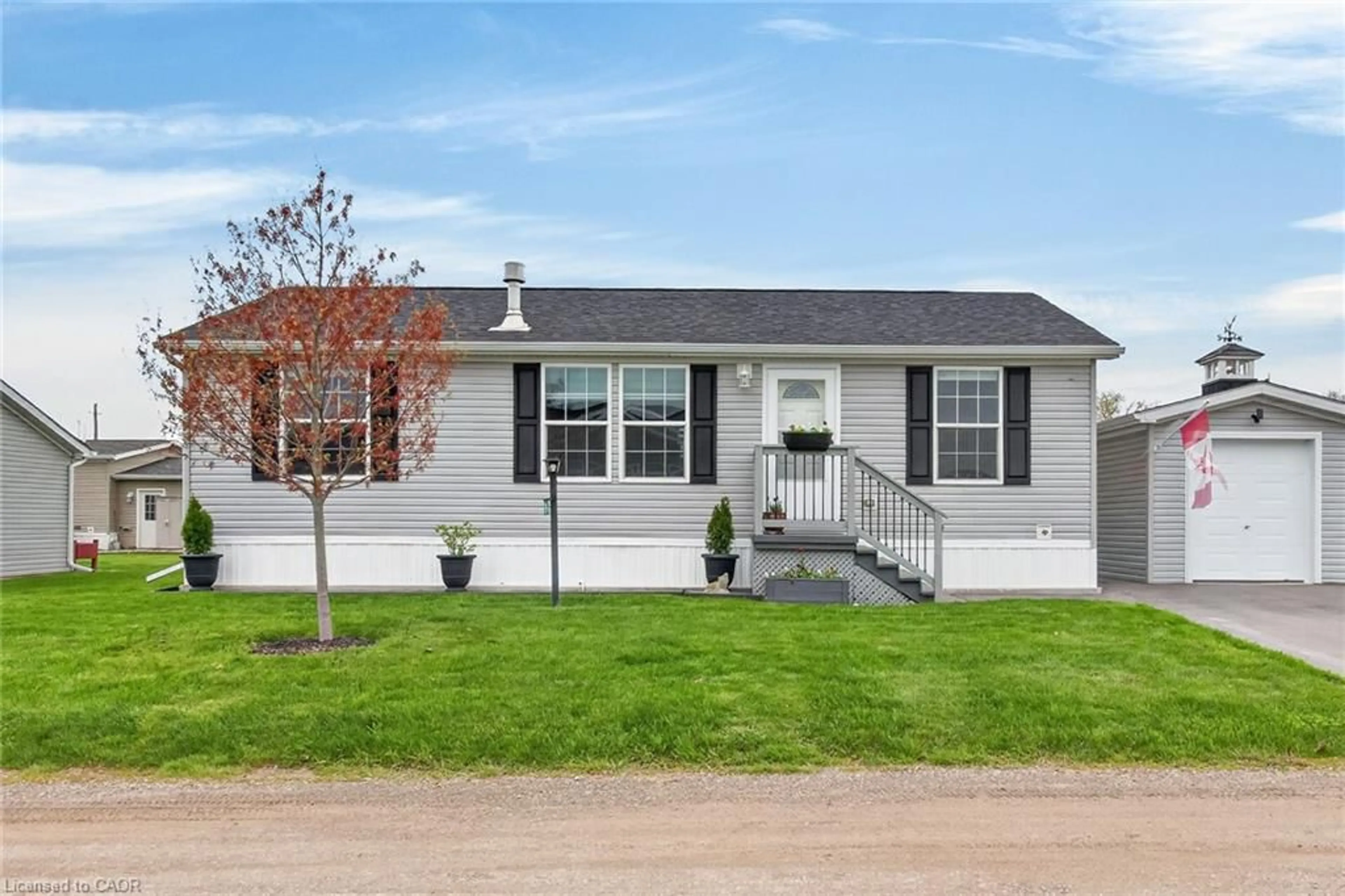 Home with vinyl exterior material, street for 19 Silver Aspen Dr, Nanticoke Ontario N0A 1L0