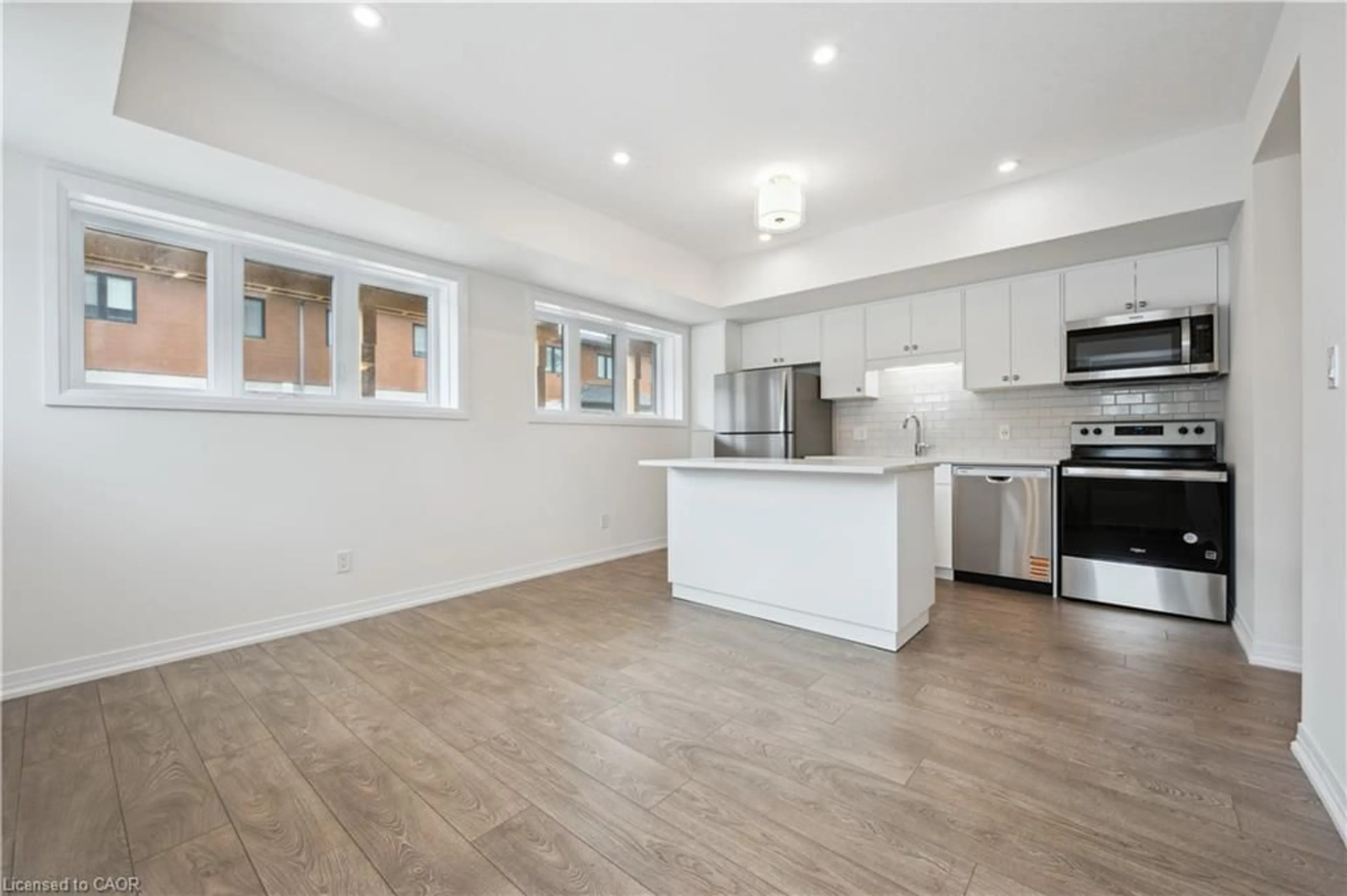 Open concept kitchen, wood/laminate floor for 15 Stauffer Woods Trail #C11, Kitchener Ontario N2P 0L1