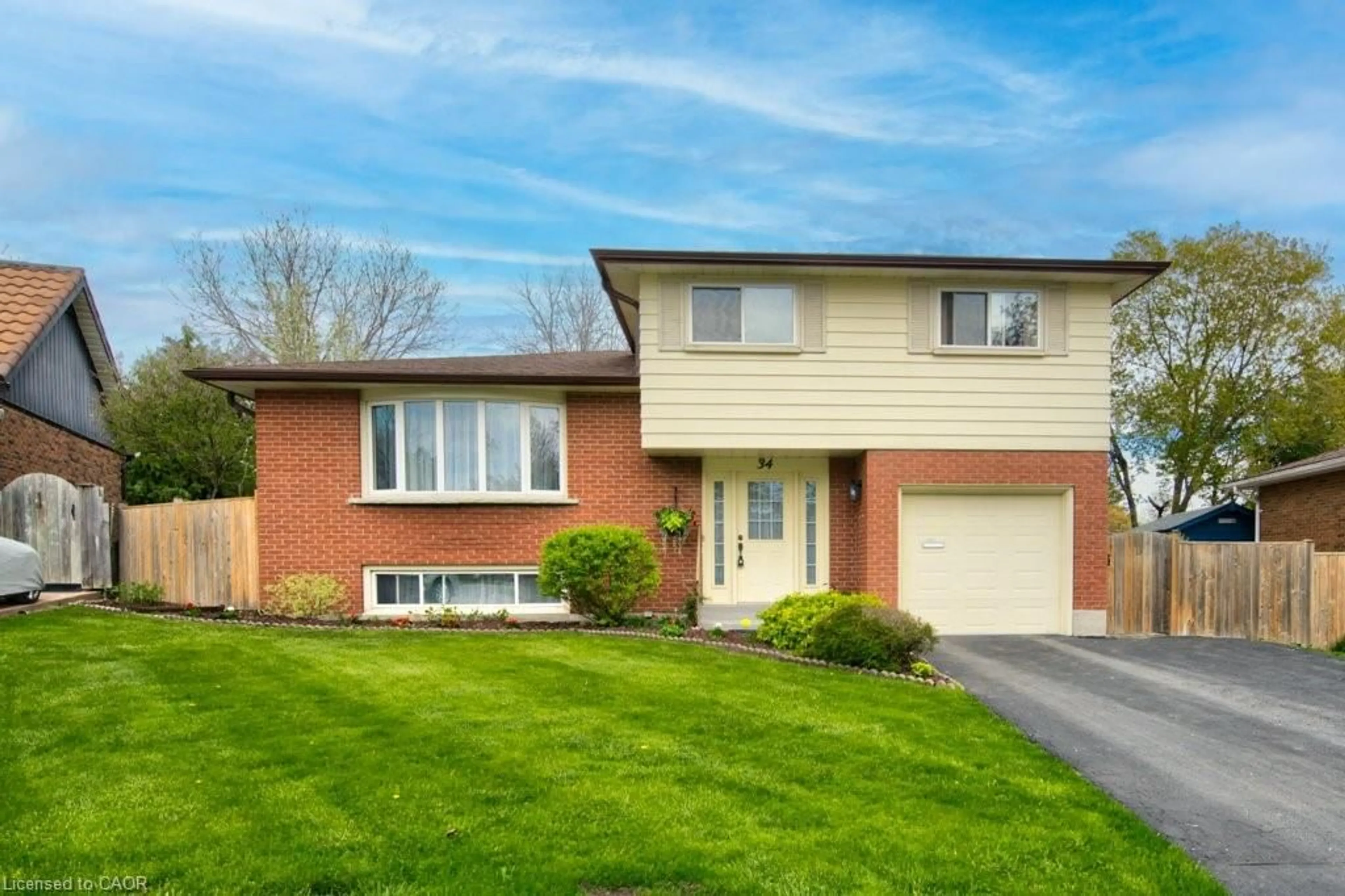 Home with brick exterior material, street for 34 Westwood Cres, Kitchener Ontario N2M 2L8