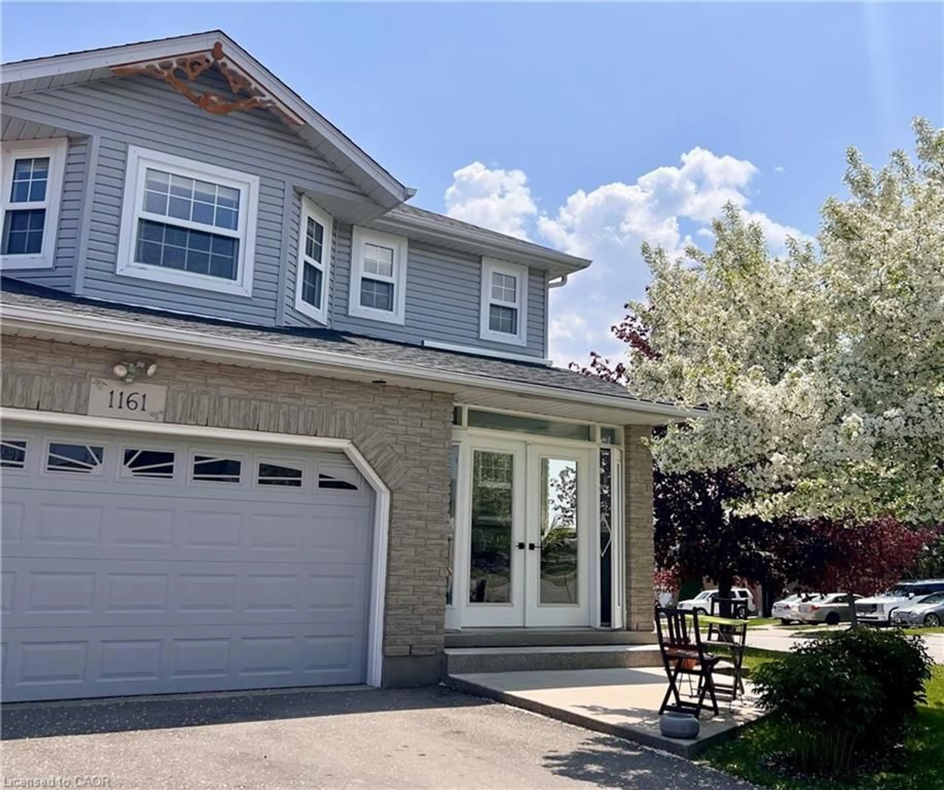 Home with vinyl exterior material, street for 1161 Countrystone Dr, Kitchener Ontario N2N 3H4