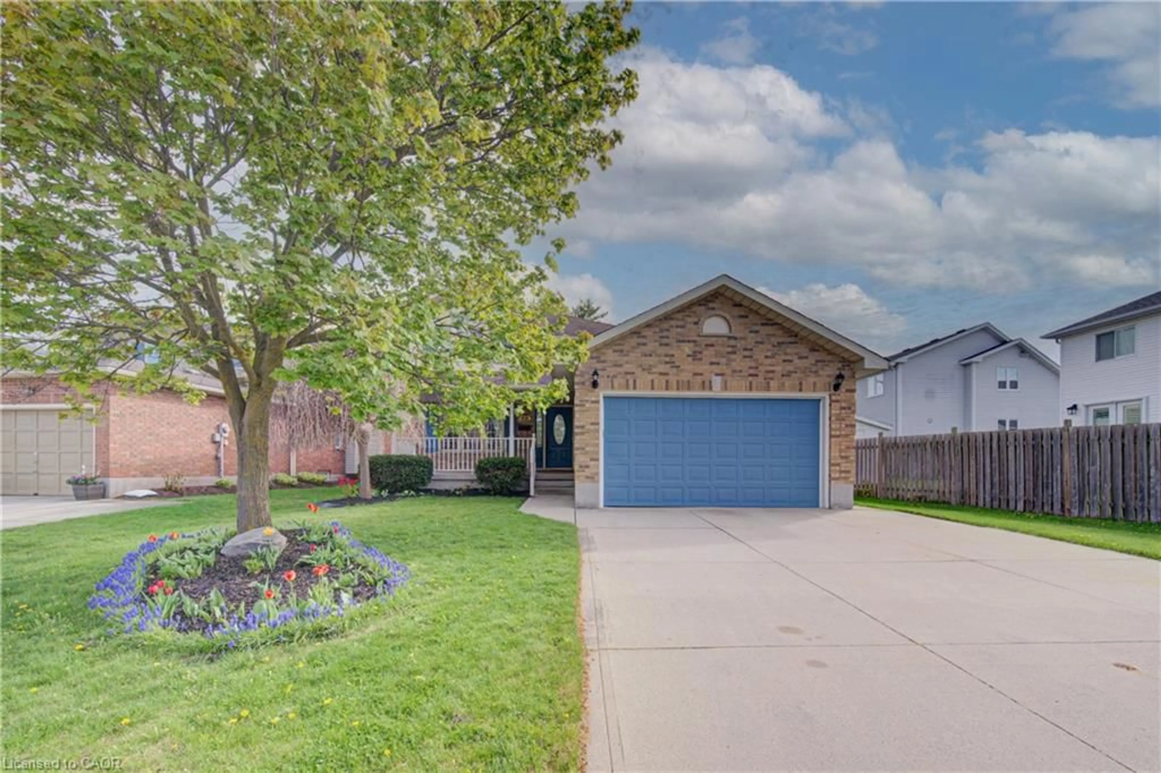Home with brick exterior material, street for 225 Dartmoor Cres, Waterloo Ontario N2K 3S9