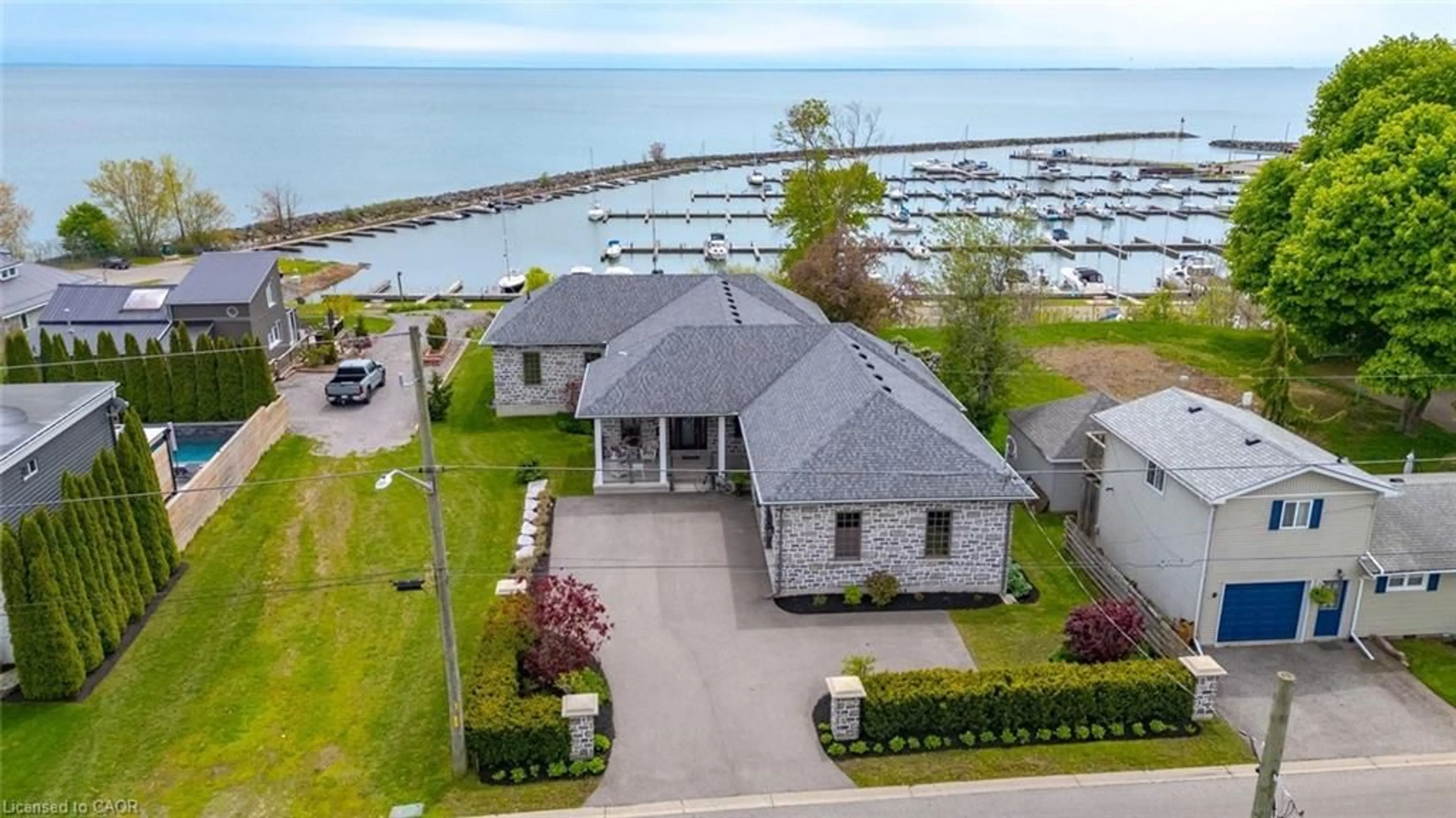 A pic from outside/outdoor area/front of a property/back of a property/a pic from drone, water/lake/river/ocean view for 70 Brown St, Port Dover Ontario N0A 1N7