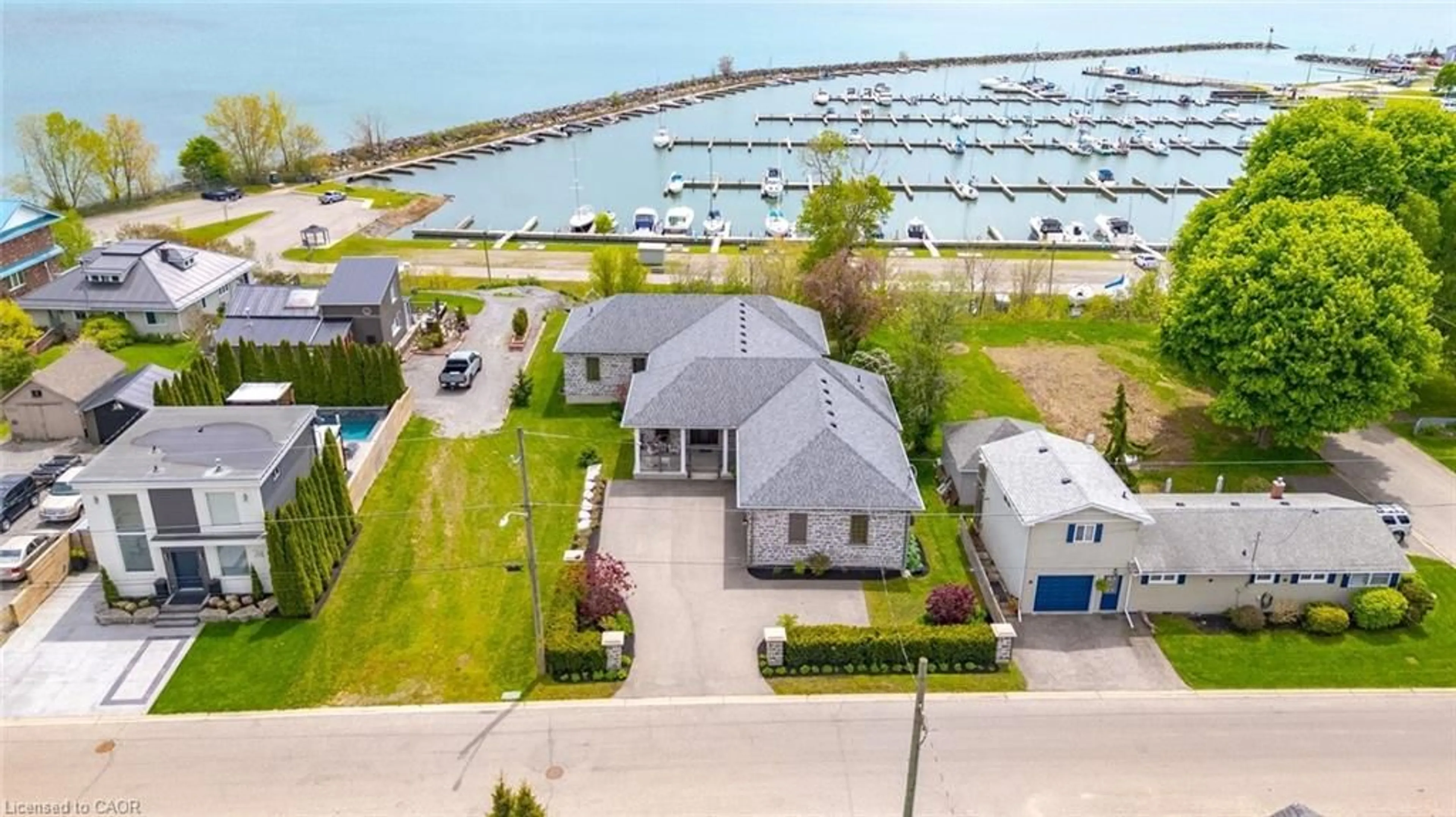 A pic from outside/outdoor area/front of a property/back of a property/a pic from drone, water/lake/river/ocean view for 70 Brown St, Port Dover Ontario N0A 1N7