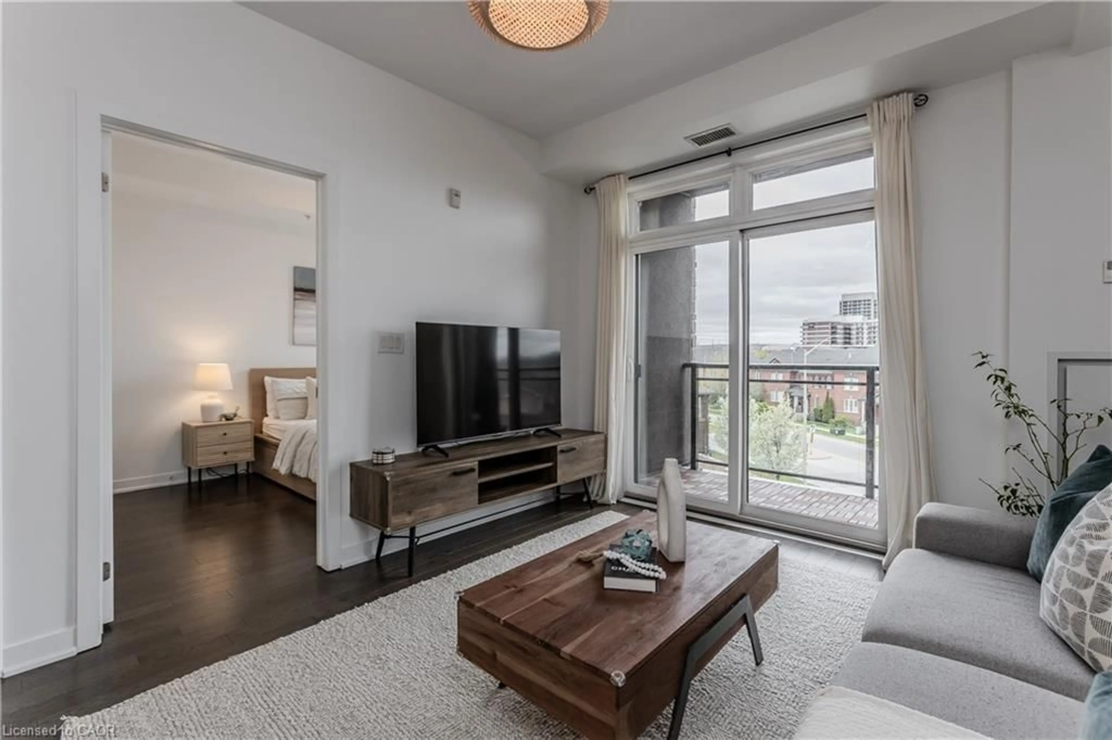 Living room with furniture, unknown for 5010 Corporate Dr #307, Burlington Ontario L7L 0H6