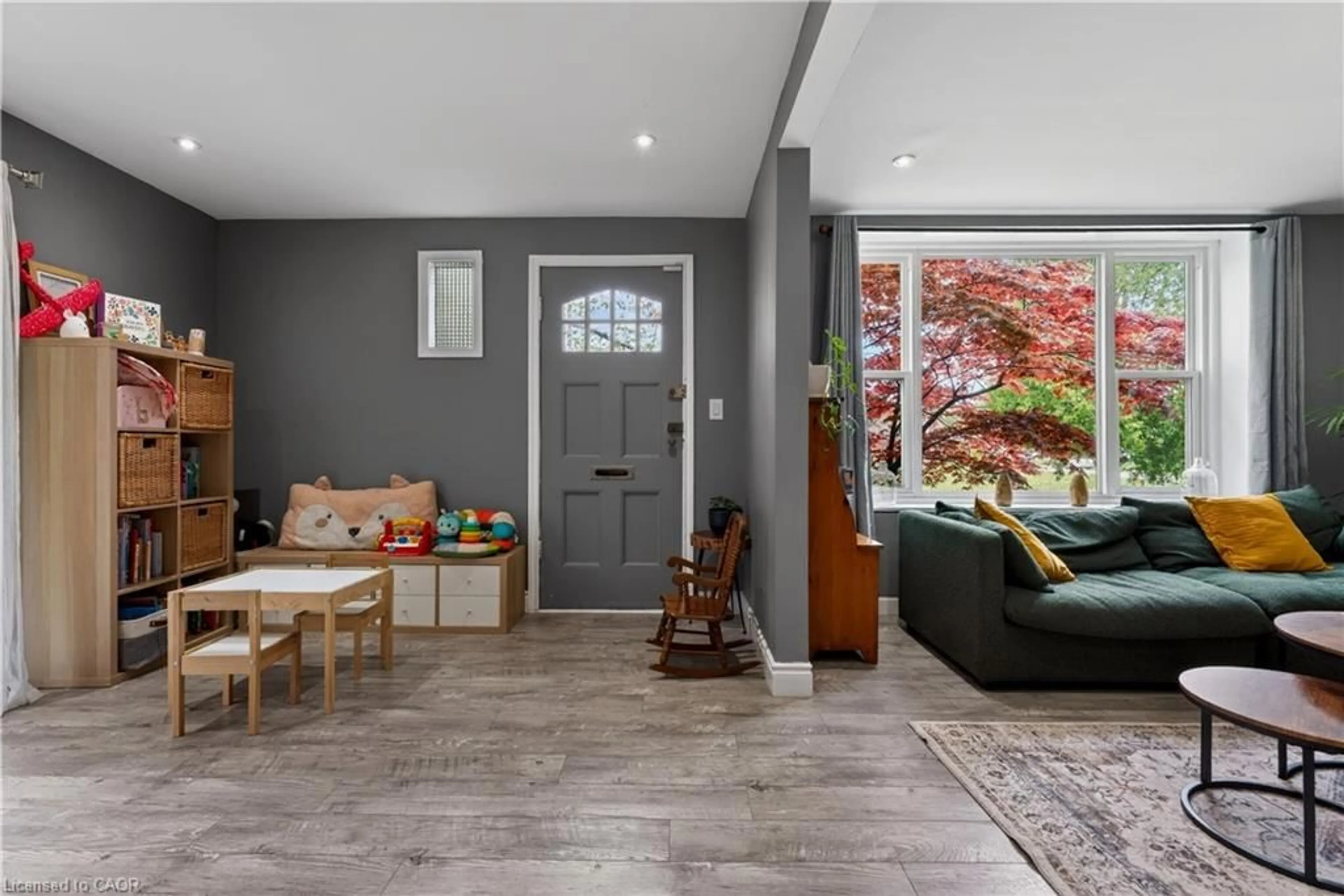 Living room with furniture, ceramic/tile floor for 215 Iona Ave, Hamilton Ontario L8S 2M3